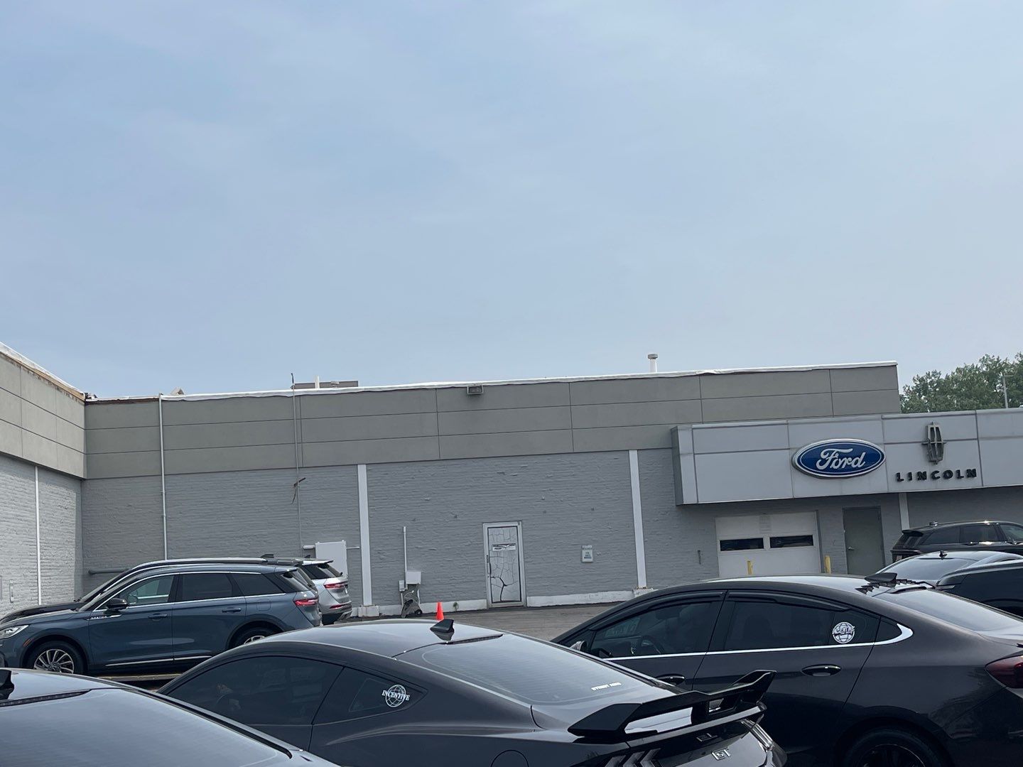 Ford Dealership - Re-Roof by Pink Roofing