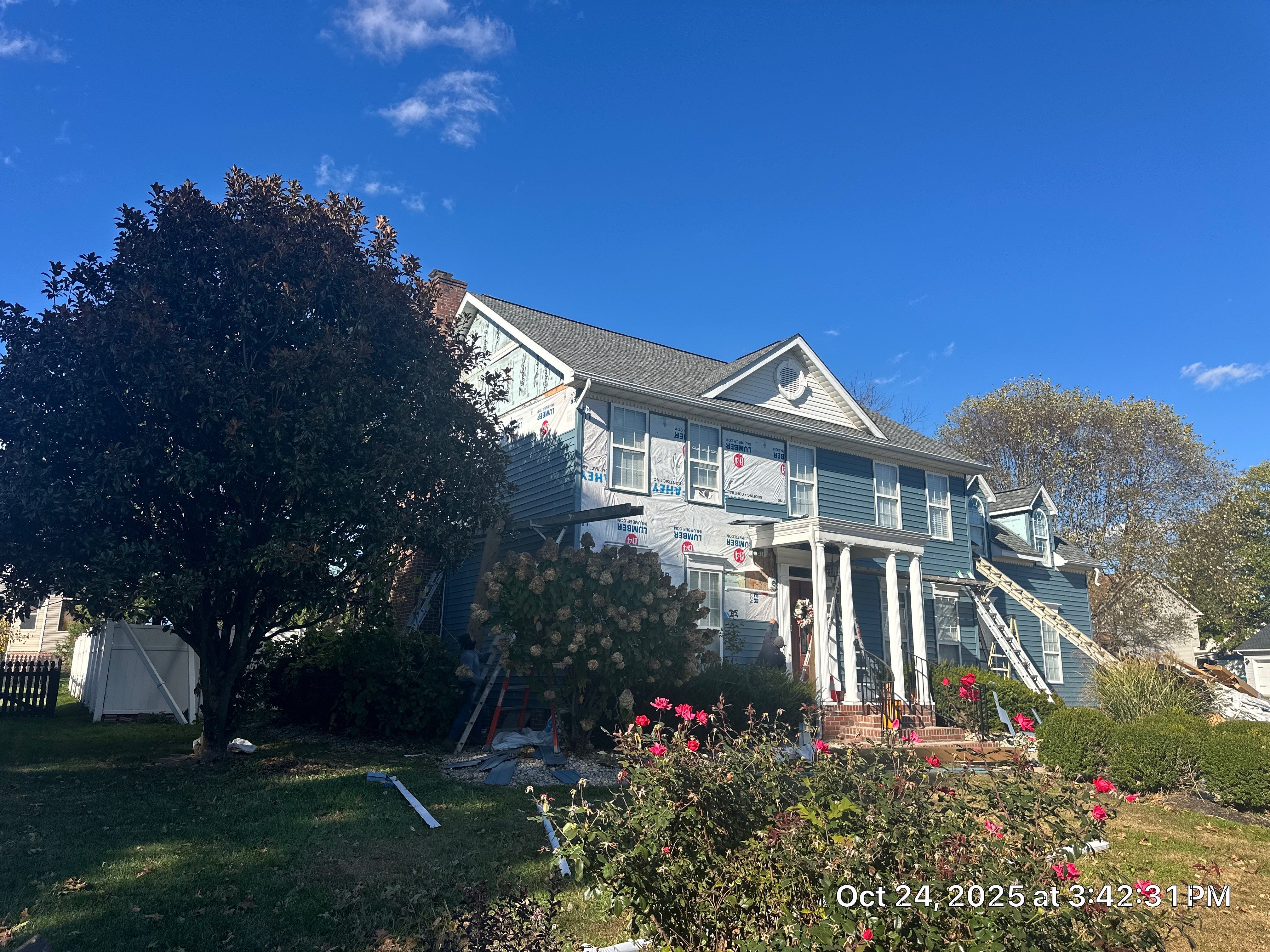 Landmark Pro, Siding, and 6" Gutters by Fahey Roofing + Contracting