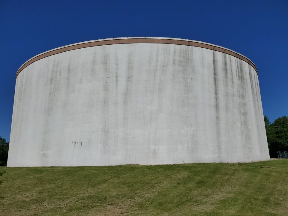 Water tank cleaning by Northern Power Washing LLC.