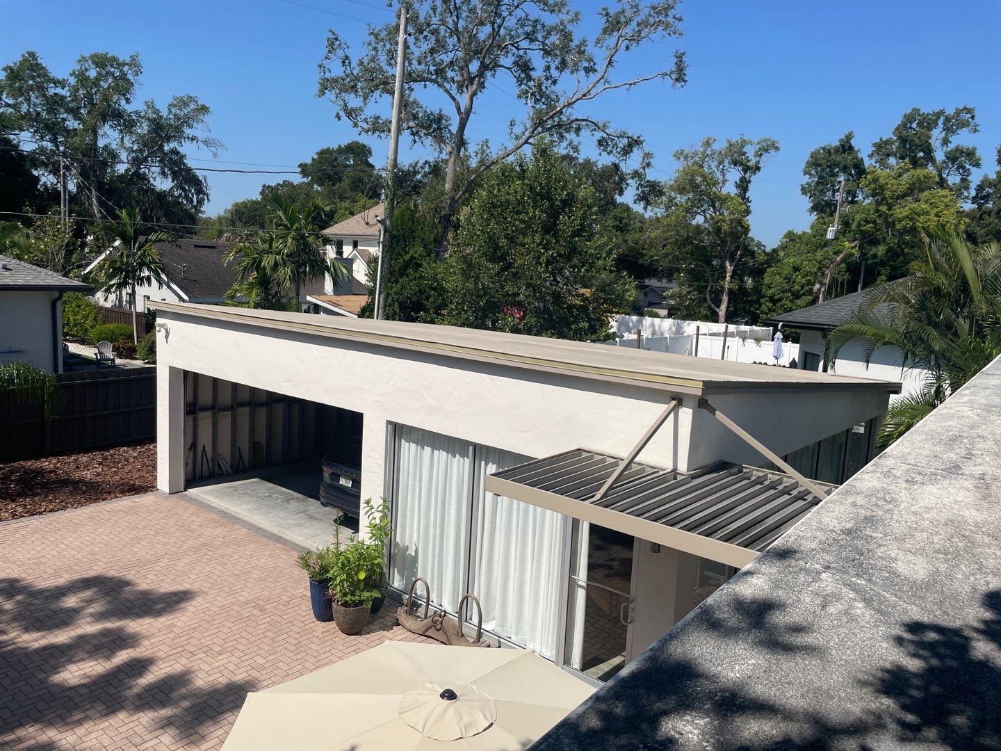 Residential Flat Roof Membrane and Tile Accents in Winter Park by Tip Top Roofing Co., Inc.