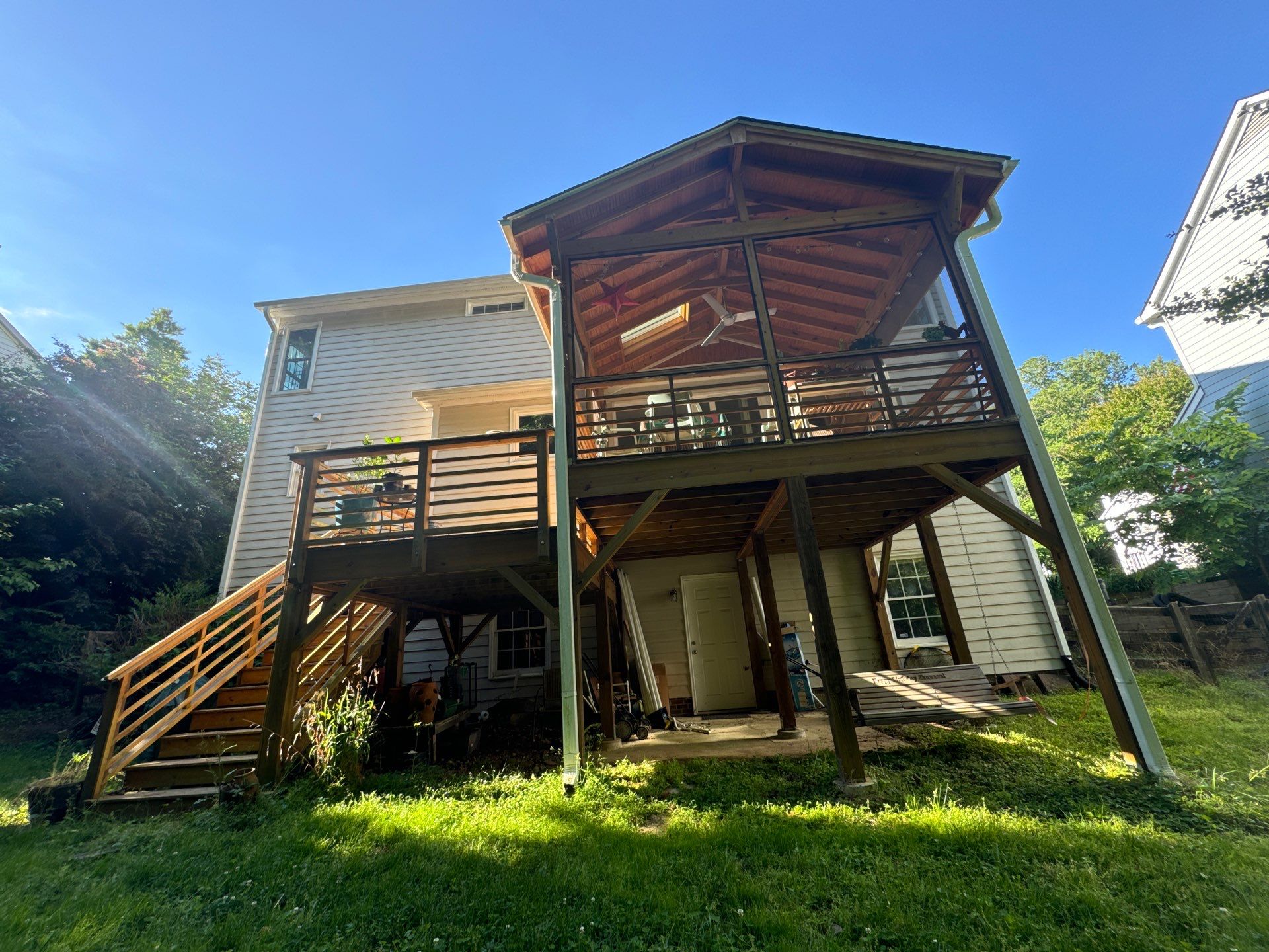 Porch staining by GonzalezPainters & Contractors Inc 