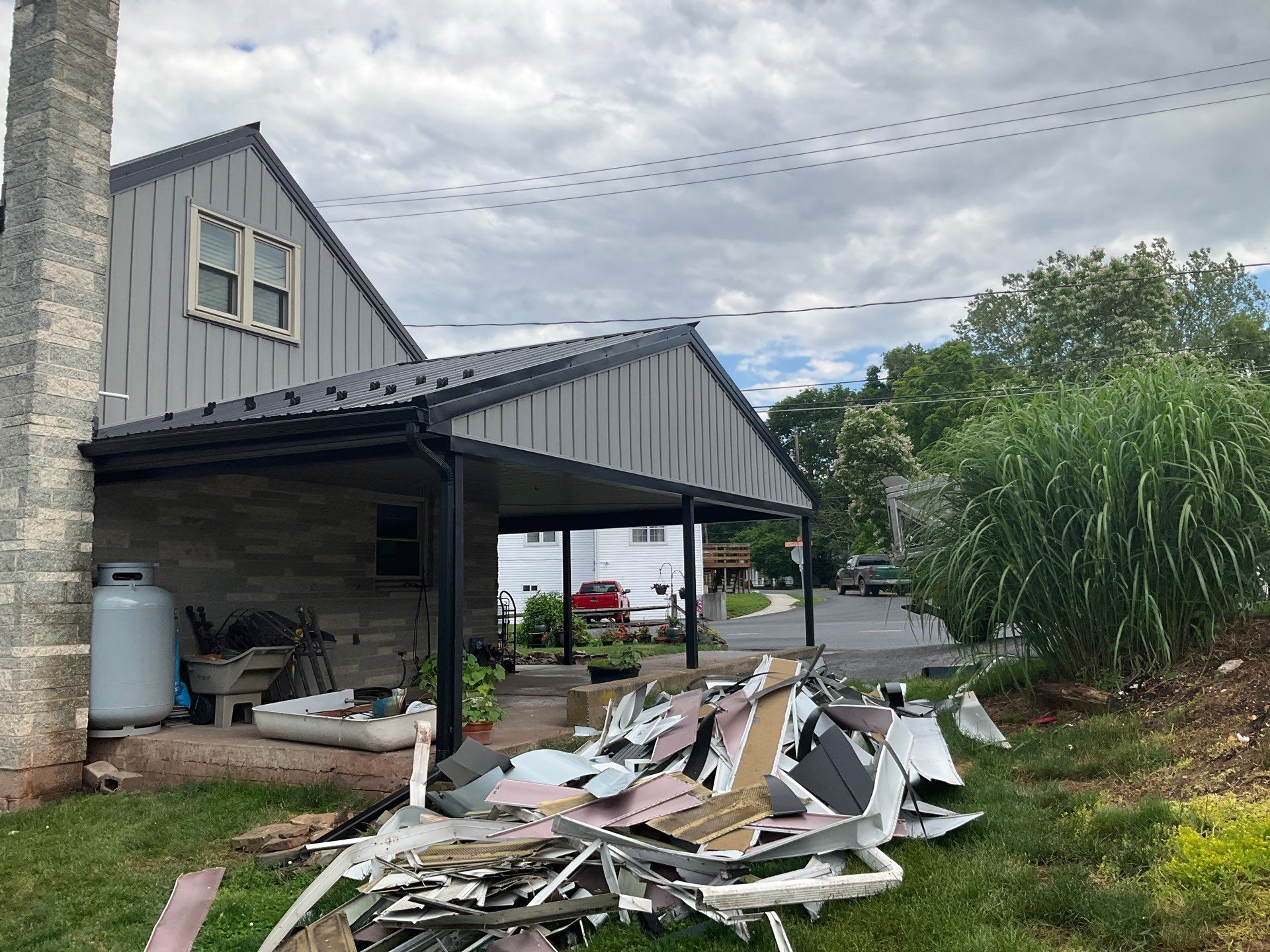 Metal Roofing, Board & Batten Siding, and Entry Door Transformation by Esh Builders