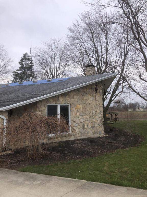 Storm damage roof replacement by Nitro Roofing and Construction