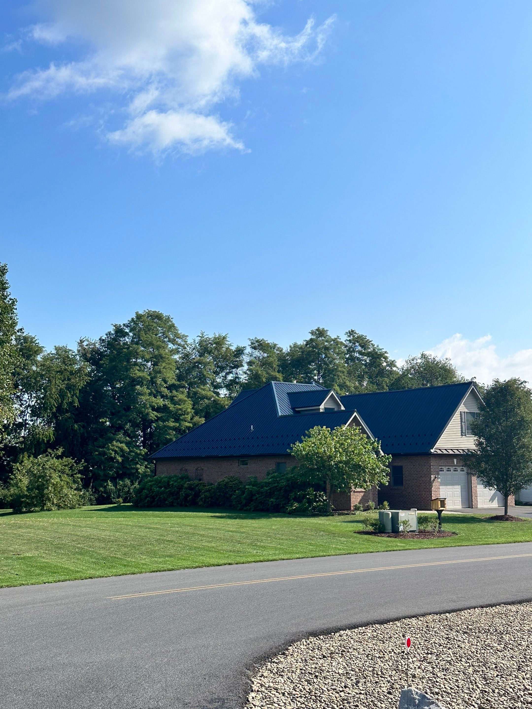Standing seam / Azm panel in black  by Teflon Roofing