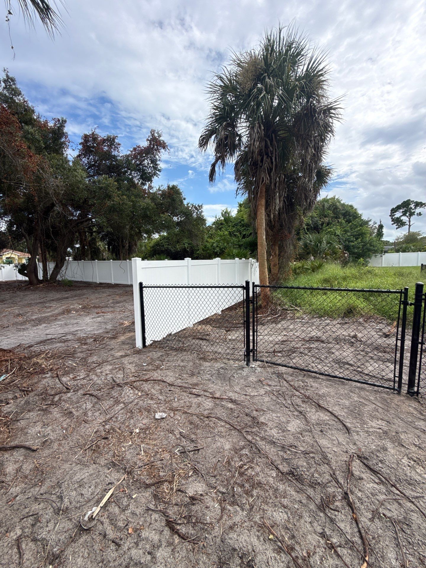White Vinyl Privacy Fence Installation in North Port Florida by True Fence LLC