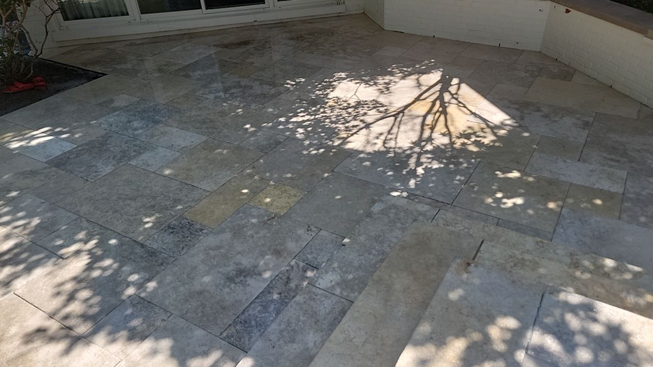 marble patio cleaning and sanding using Polysweep polymeric sand by Northern Power Washing LLC.