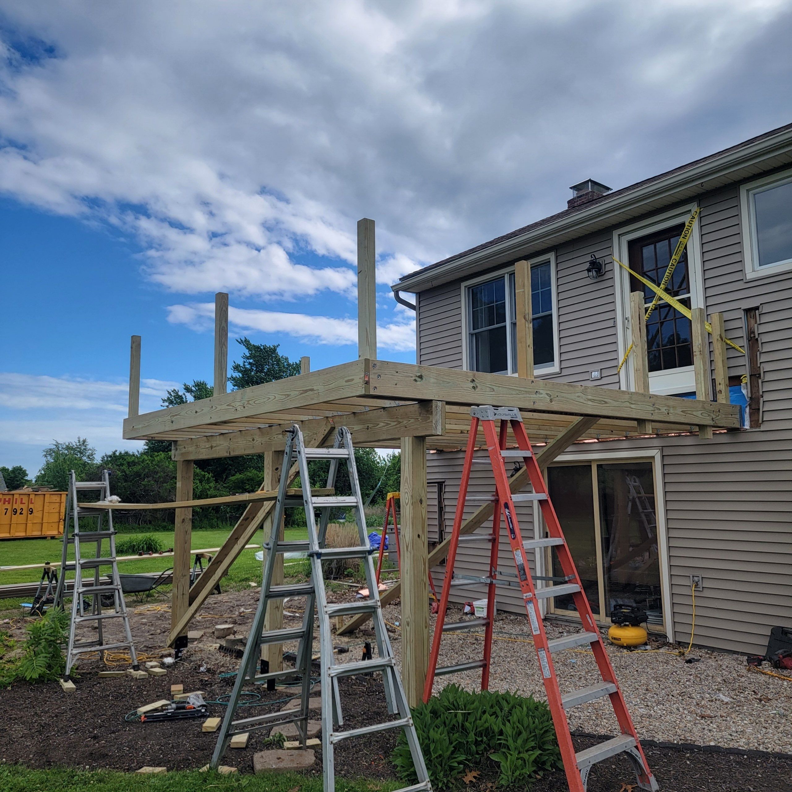 Deck Replacement using Trex Tropical Havana Gold and matching transcend cocktail railing.  by DiGiorgi Roofing and Siding Inc