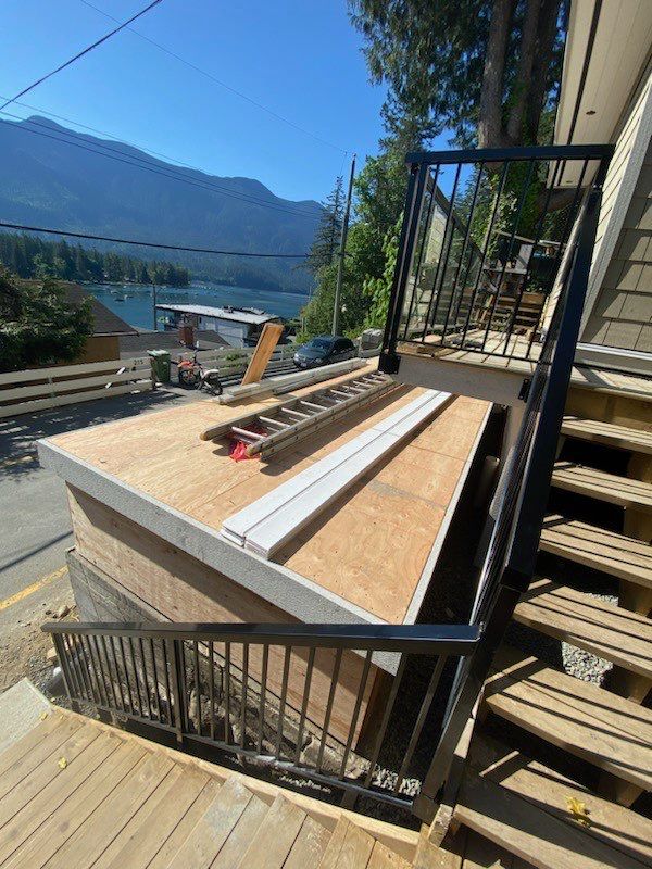 Small patio roof with 2ply sbs  by Top Notch Roofing Inc