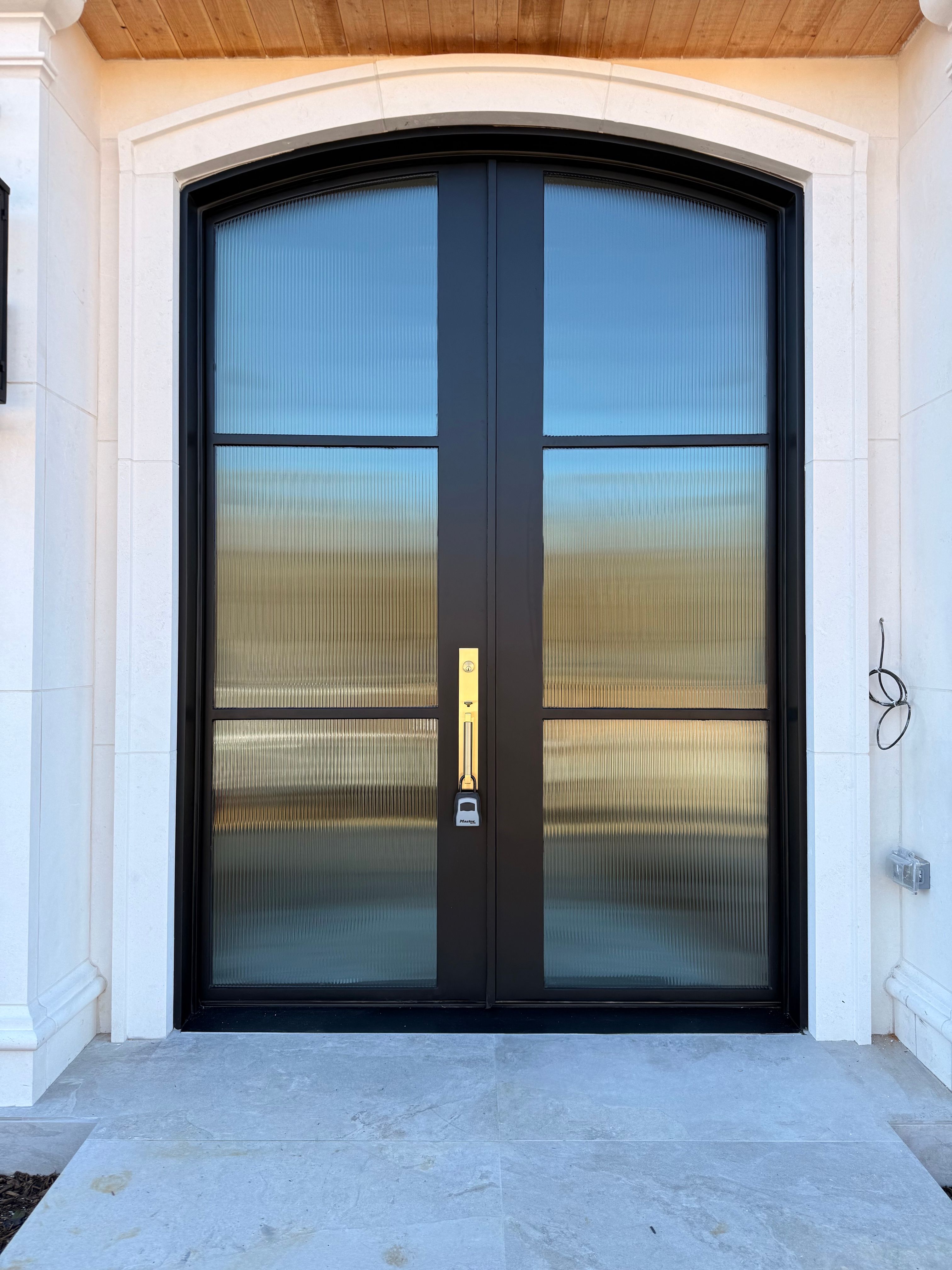Custom Arched Entry Door Installation and Finishing in Southlake by Solara Custom Living