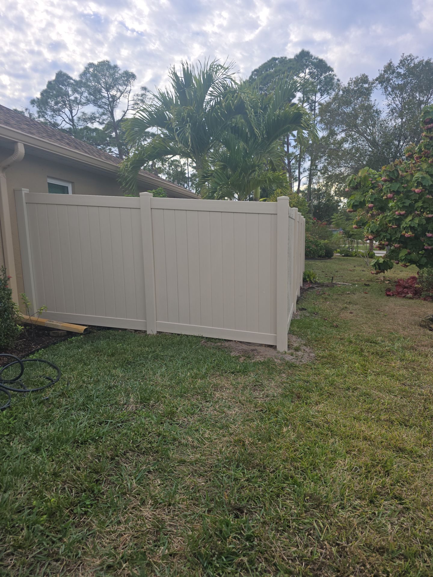 Tan Vinyl Fence in North Port by True Fence LLC