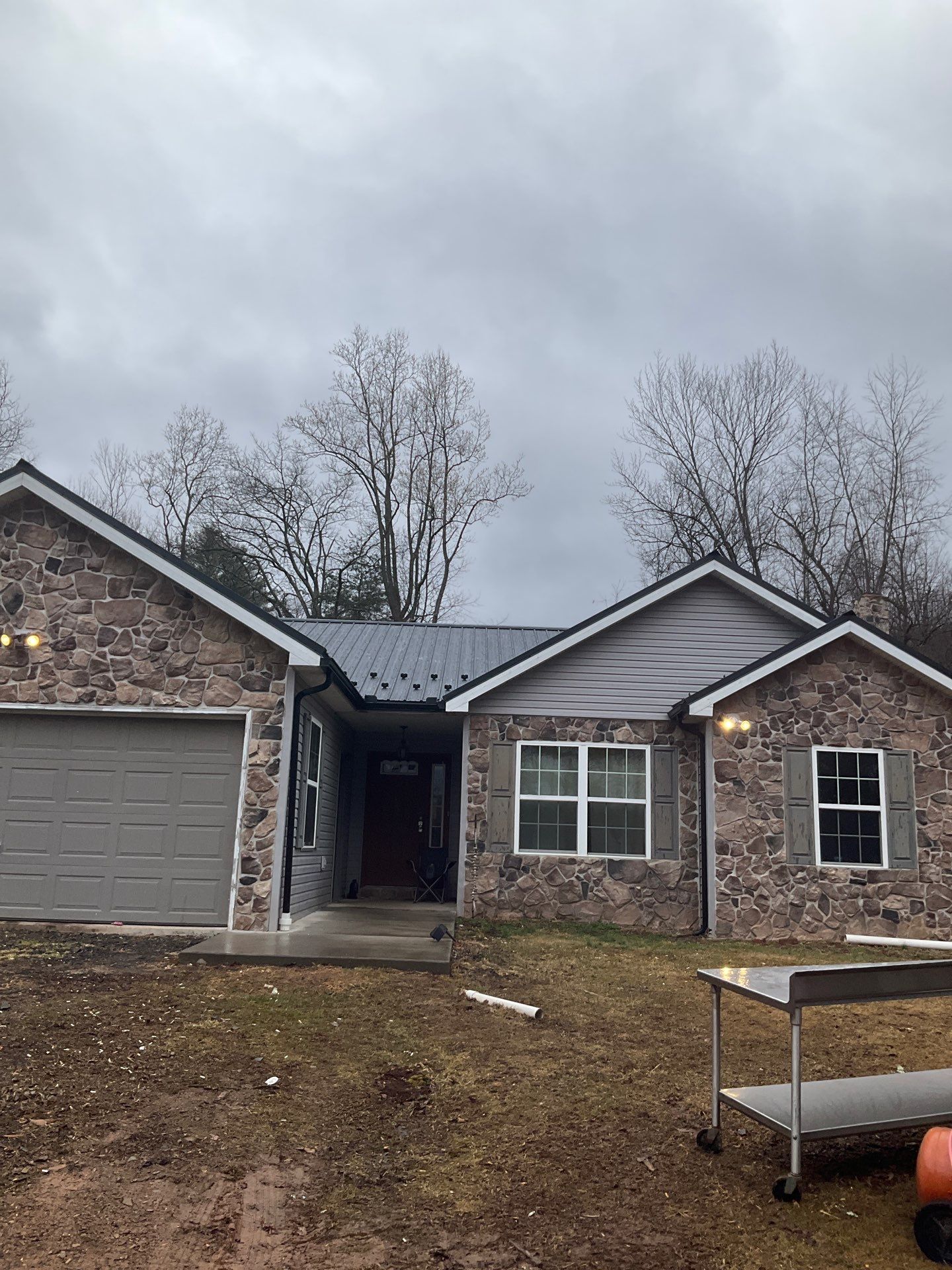 Black Metal Roof Replacement and Gutter Installation in Halifax by Esh Builders