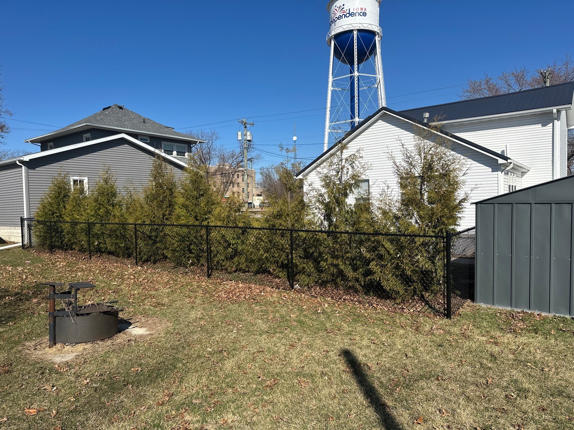 Black Chain Link Backyard Fence Installation in Independence by Perfect Picket Fence and Stain
