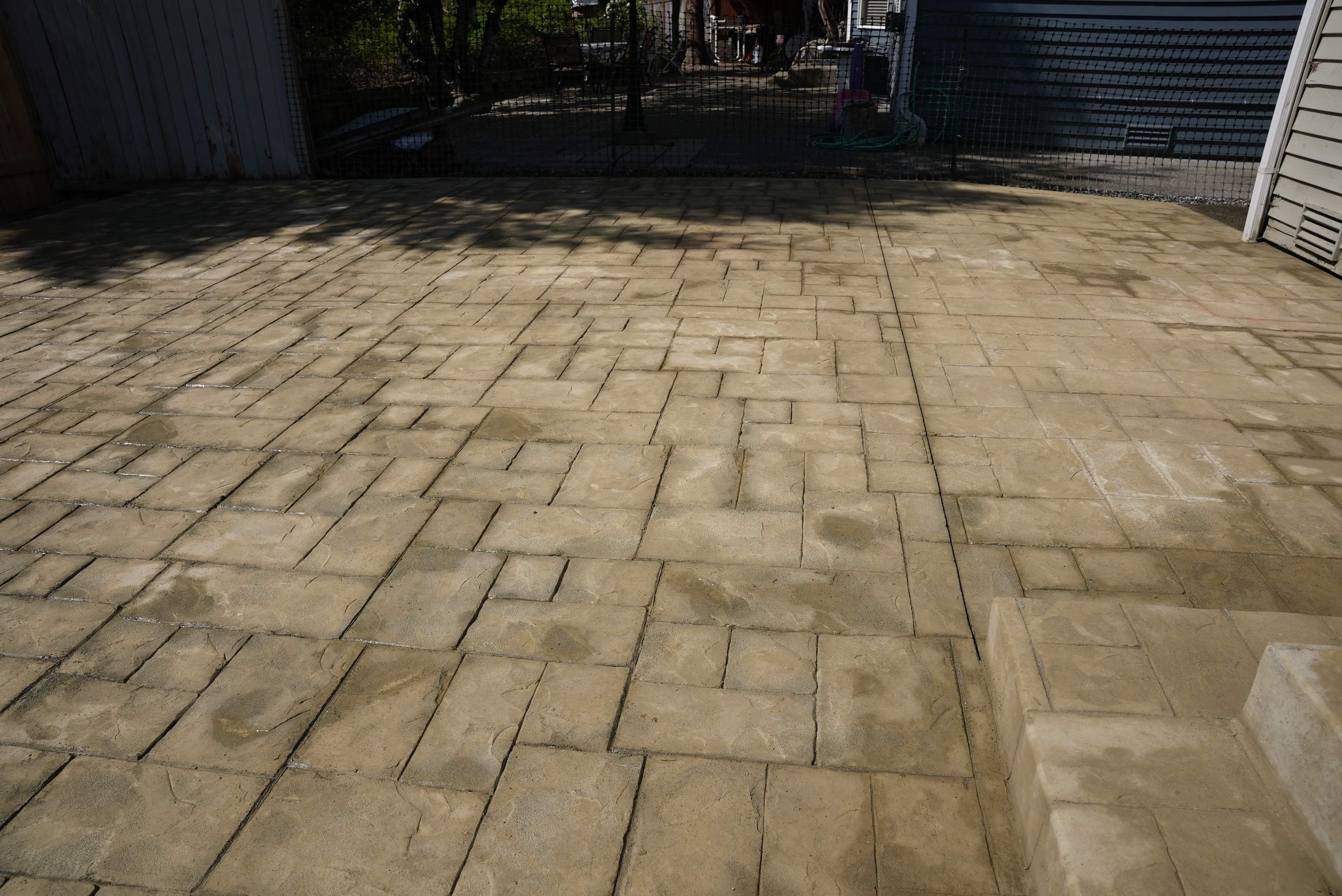 Benedict | Stamped Concrete Back Patio by Jireh Asphalt & Concrete Inc 