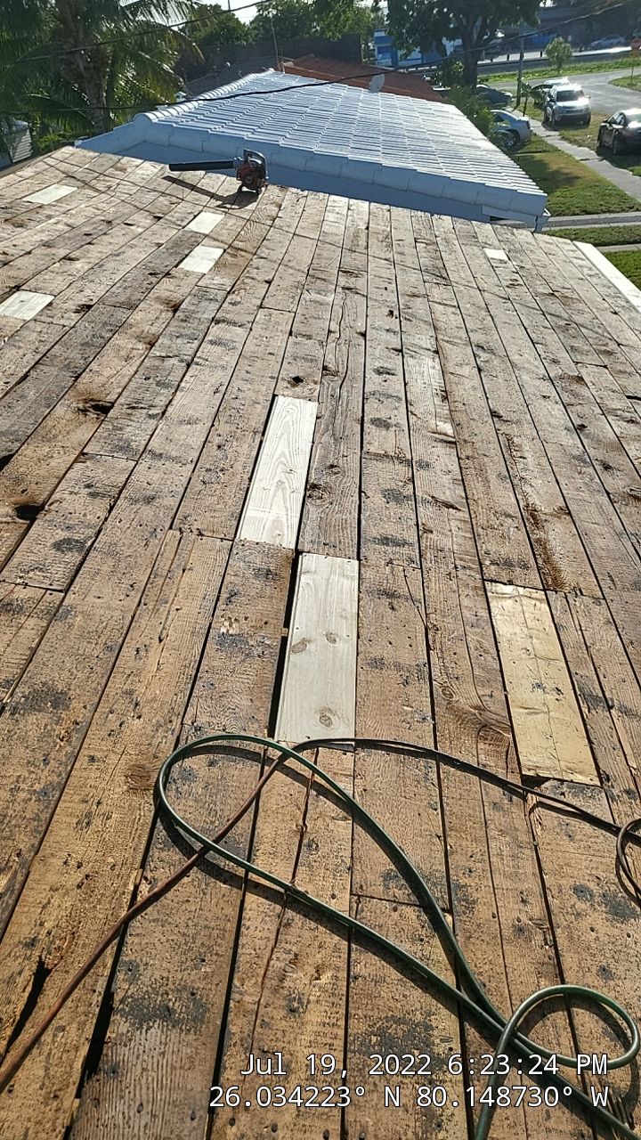 Standing Seam Metal & Flat Re-Roof using 1.5" Nail Strip 24ga Black Matte Kynar Coated Standing Seam Metal Panels by Morton Roofing, Inc.