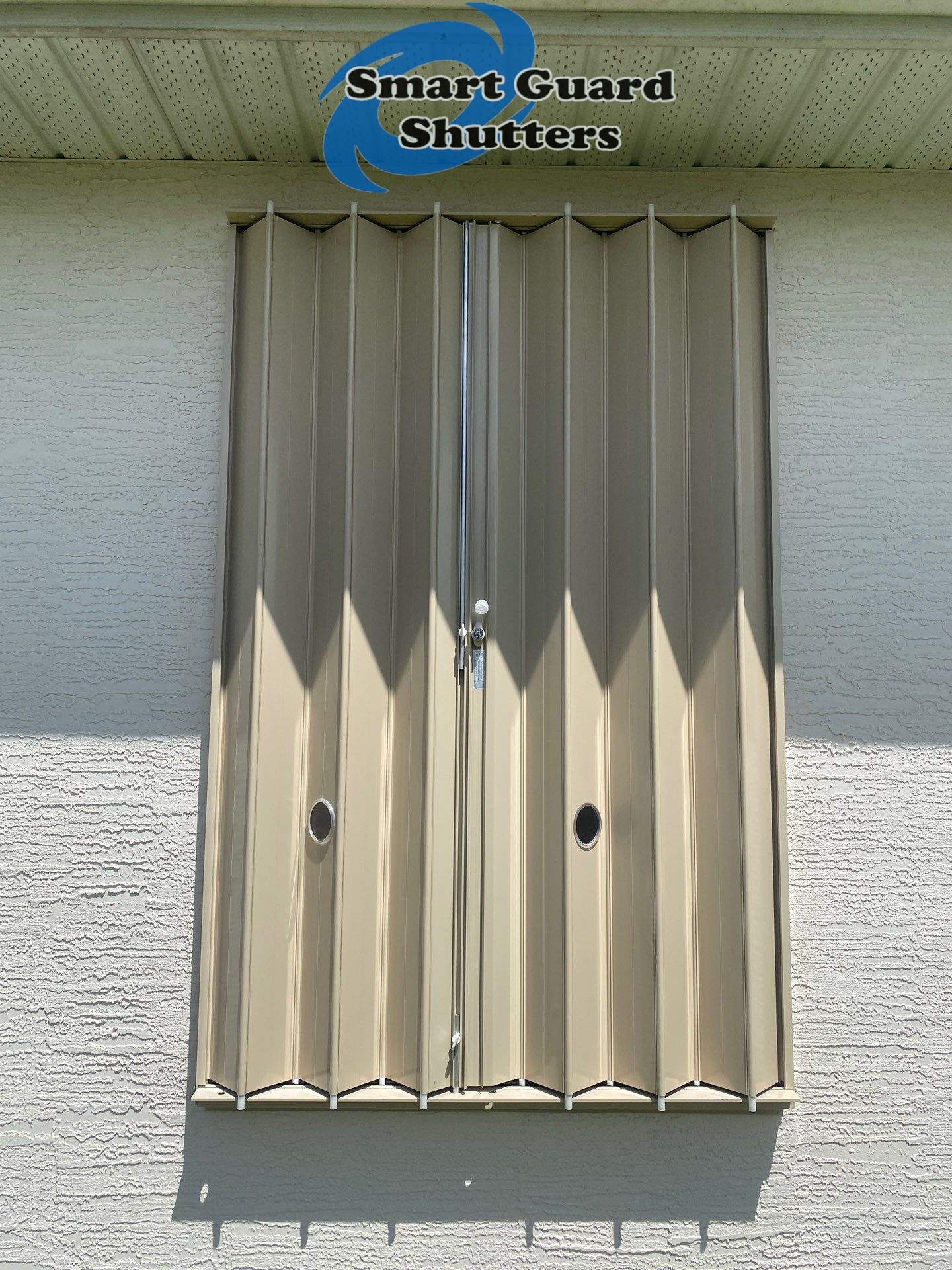Accordion Shutters in Beige  by Smart Guard Shutters