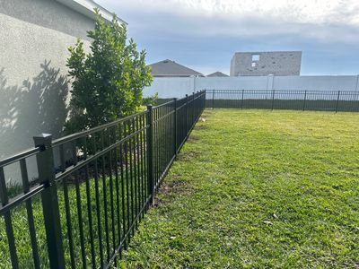 Aluminum Fence Installation using Black 3 Rail Aluminum Fence