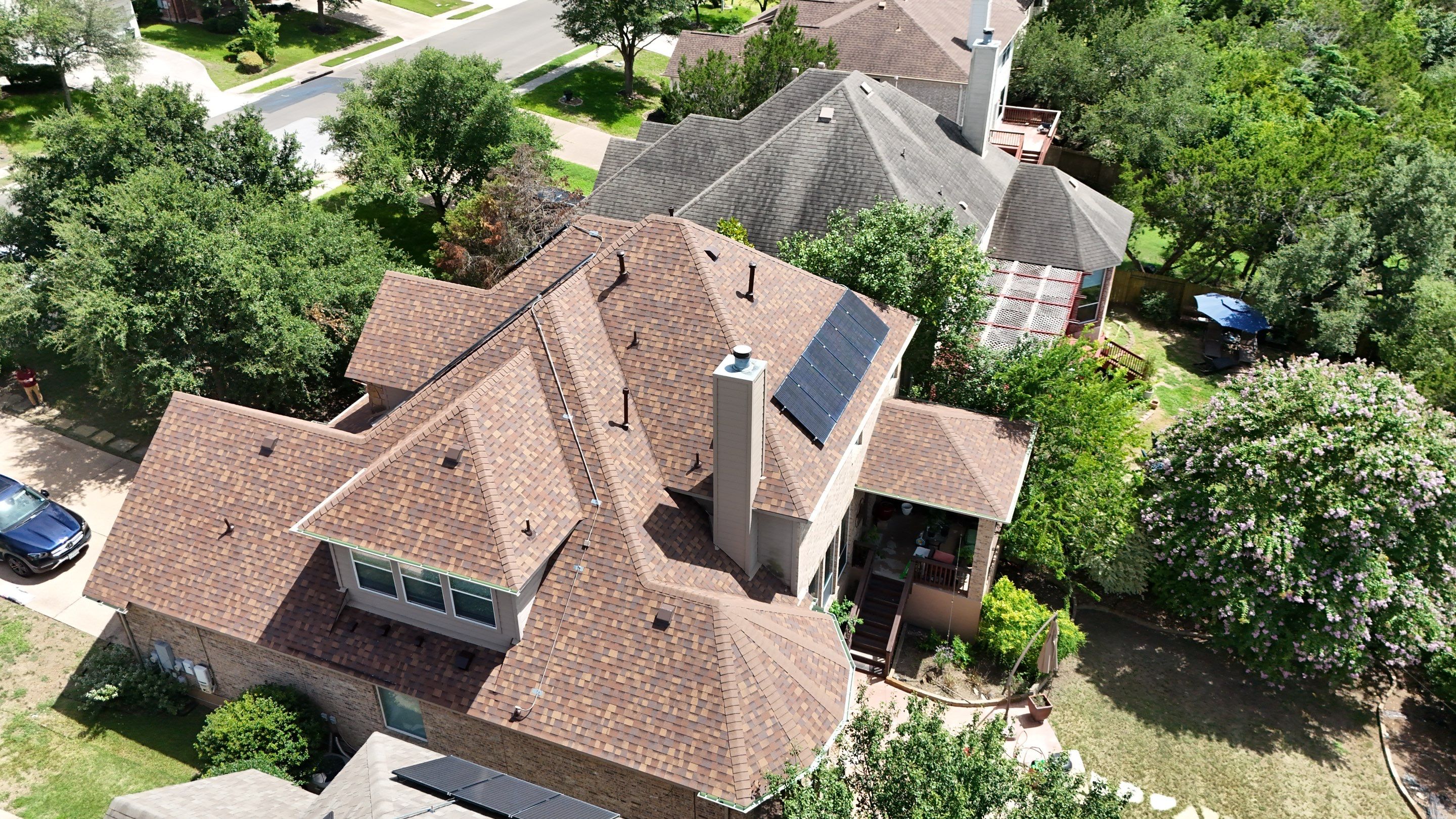 Residential Roof Replacement using Owens Corning - Duration - Desert Rose by Action Exteriors Austin