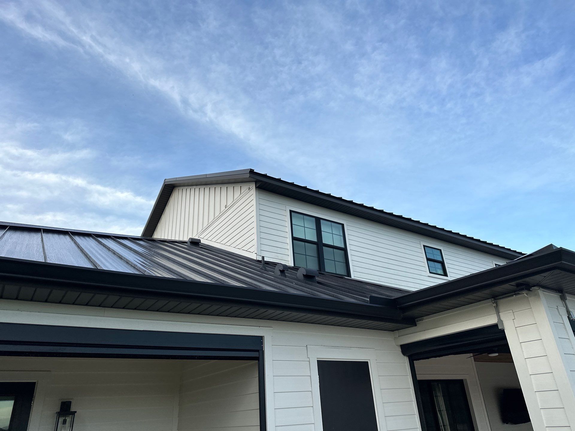 Complete Two-Story House Wash and Driveway Cleaning in Winding River Community, Bradenton, FL by Sunshine AquaWash