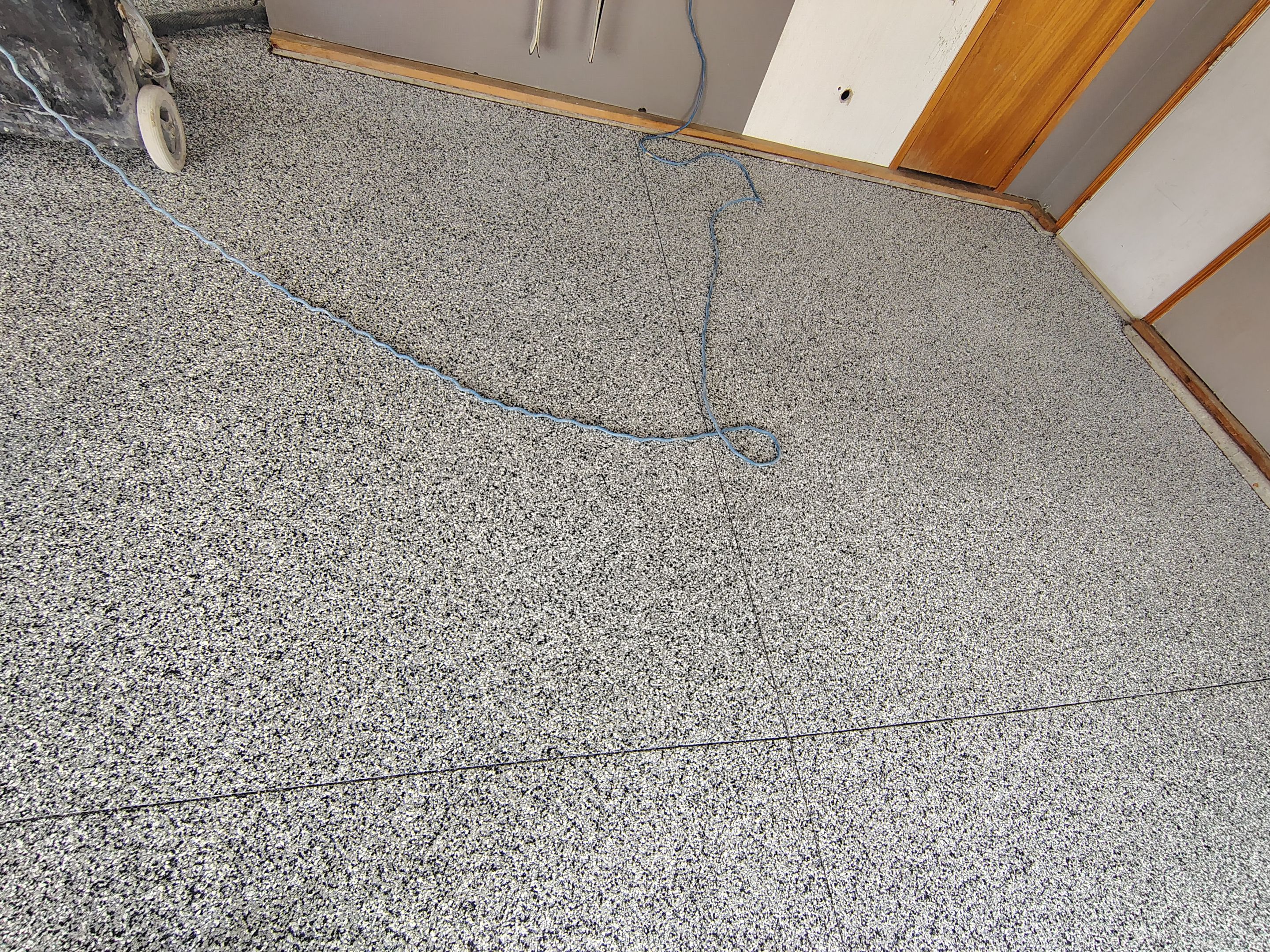 Garage Floor Concrete Coating and Crack Repair in Sioux Falls by Select Painting, Coatings & Garage Cabinets