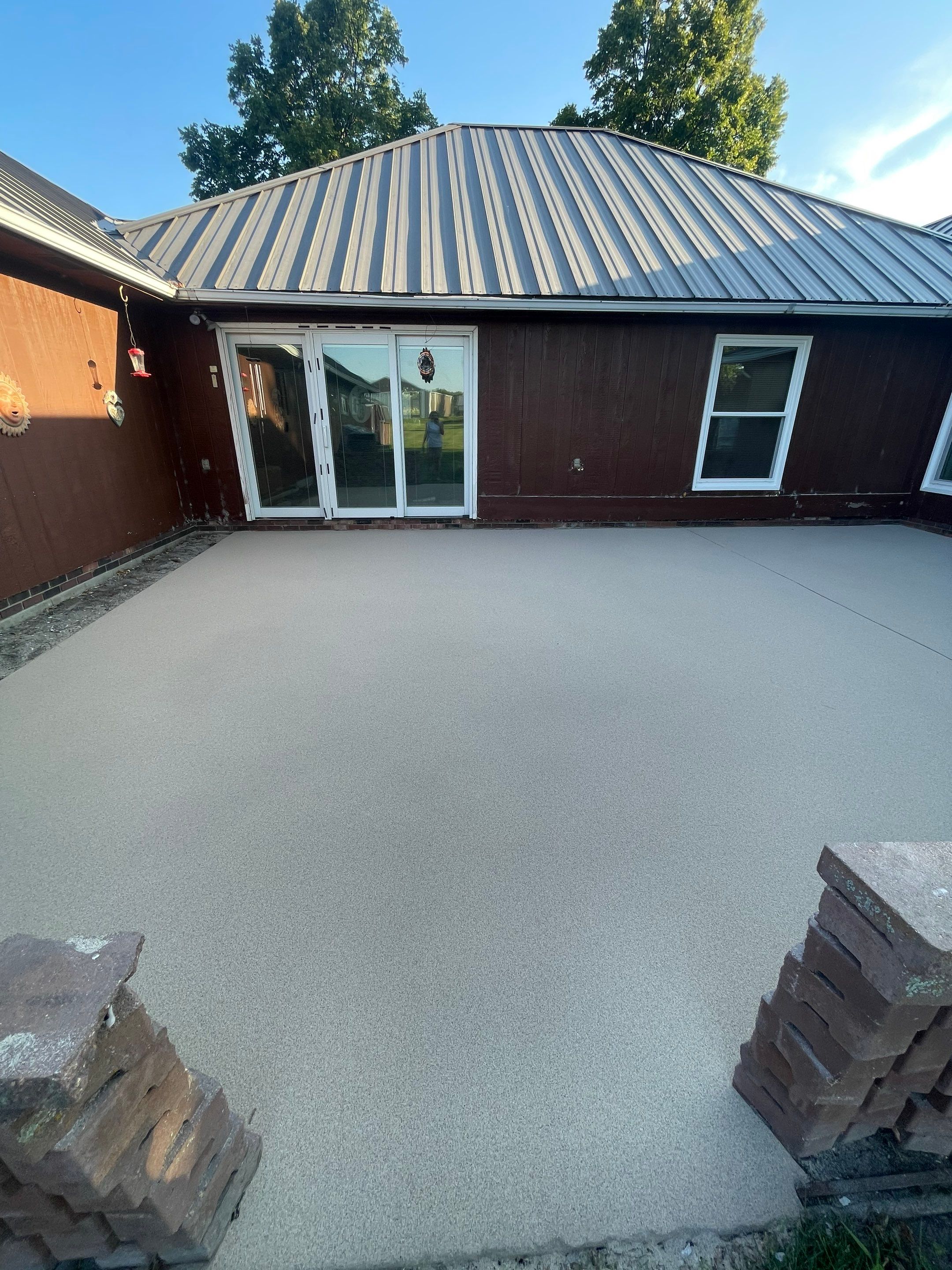 Concrete Patio Resurfacing and Protective Coating in Winfred, South Dakota by Select Painting, Coatings & Garage Cabinets