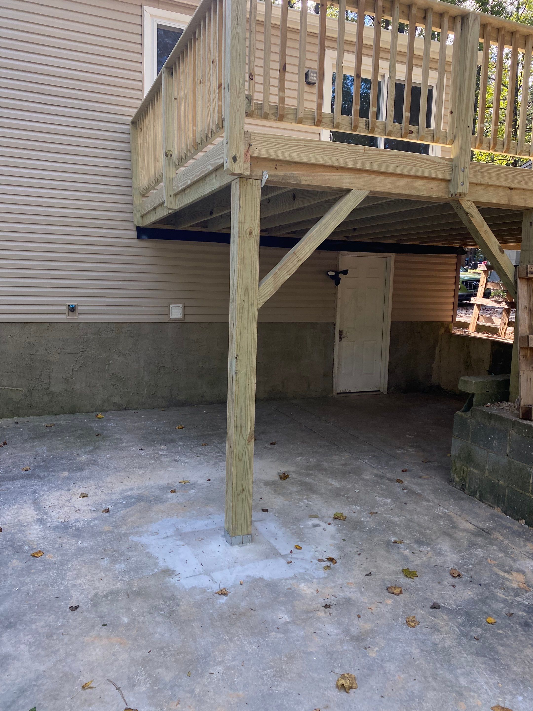 Custom Elevated Pressure-Treated Wood Deck Installation in Raleigh by The Remodeling Company