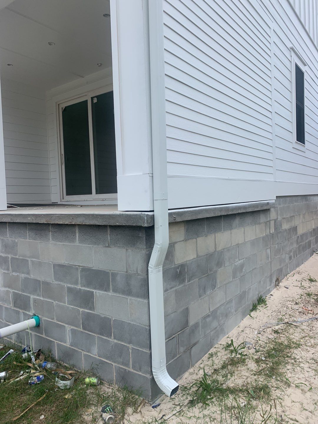 Downspout Installation for Multi-Story Building in Panama City FL by Gutter Professors