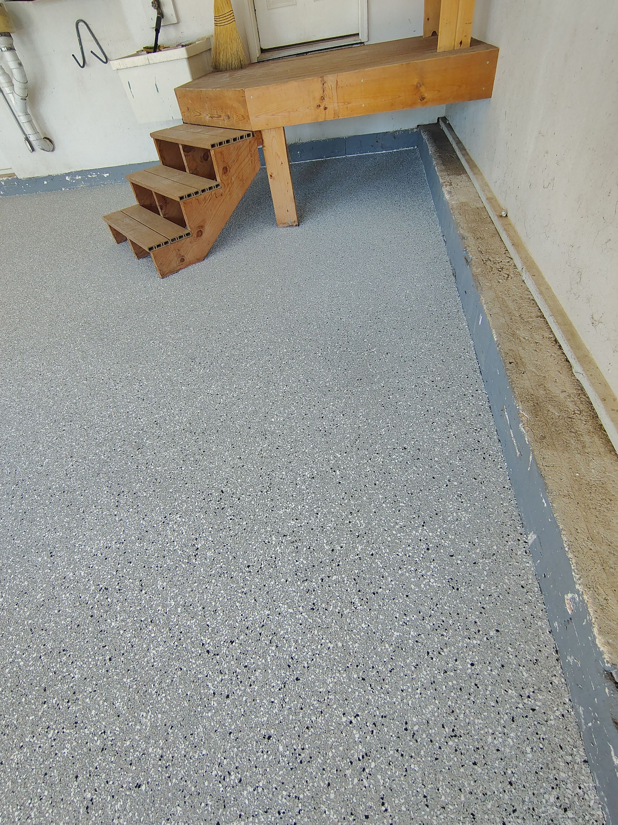 Feather Grey Garage Floor Coating Installation in Valley Springs by Select Painting, Coatings & Garage Cabinets