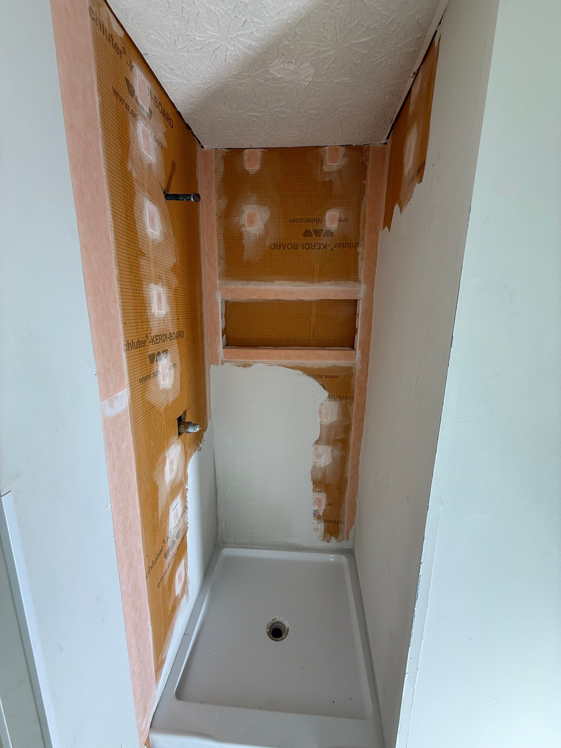 Custom Shower Renovation With Vertical Tile and Frameless Glass in Kennesaw by Swift Home Renovations