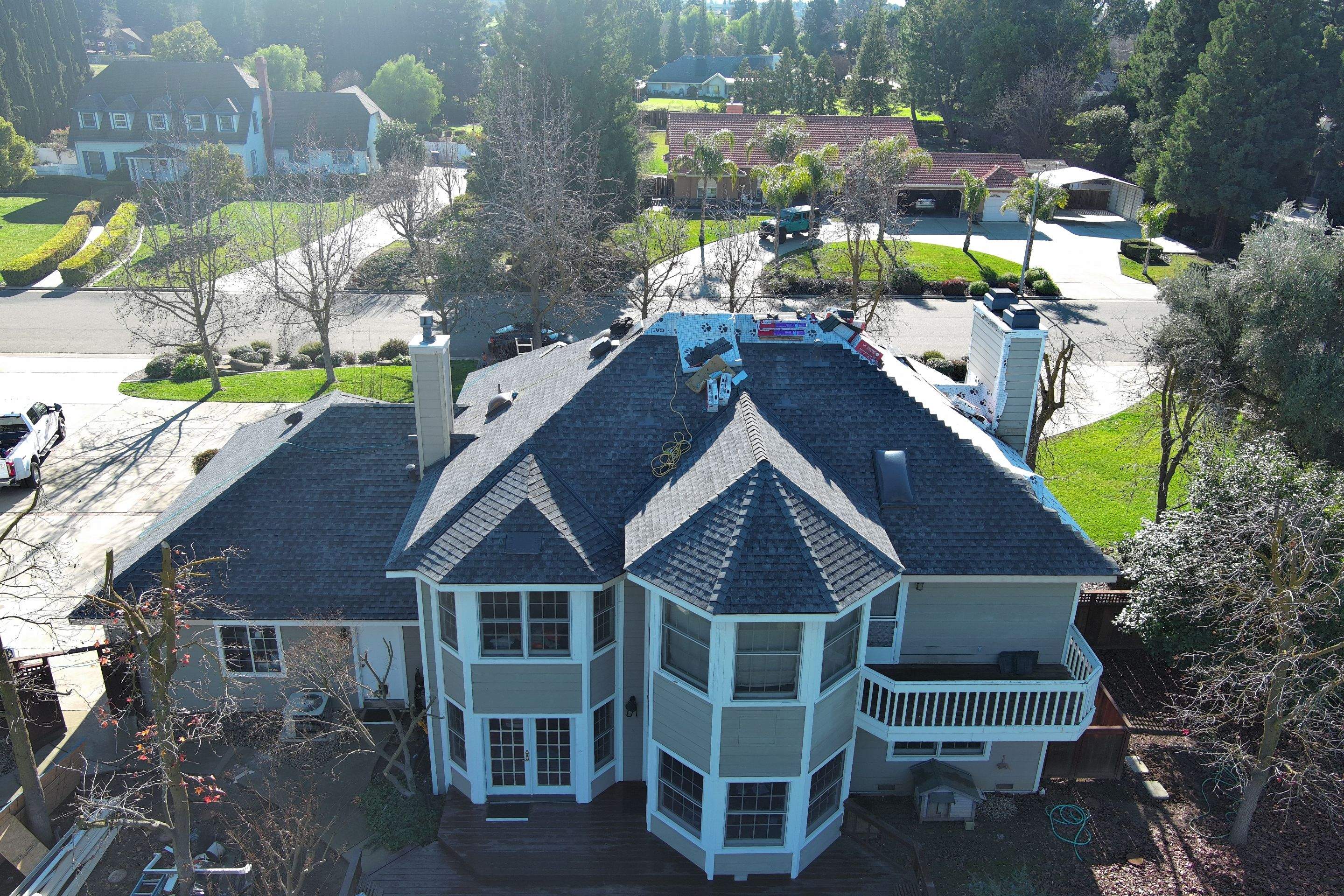 New shingles and gutters using GAF Timberline HDZ shingles and aluminum gutter by Straight Edge Roofing Inc