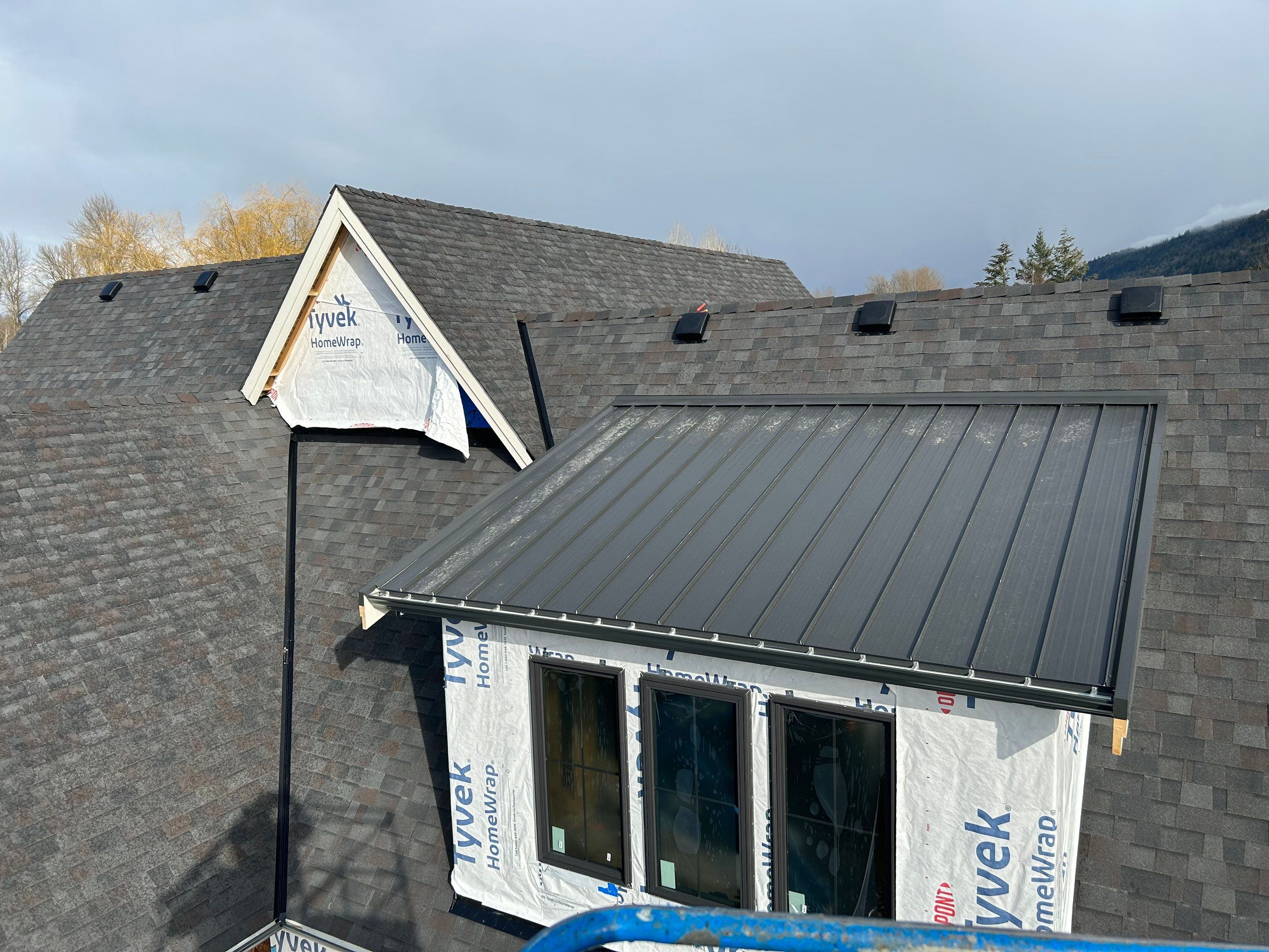 Residential Roofing Installation using Malarky Vista Shingles and Prolok Metal  by Top Notch Roofing Inc