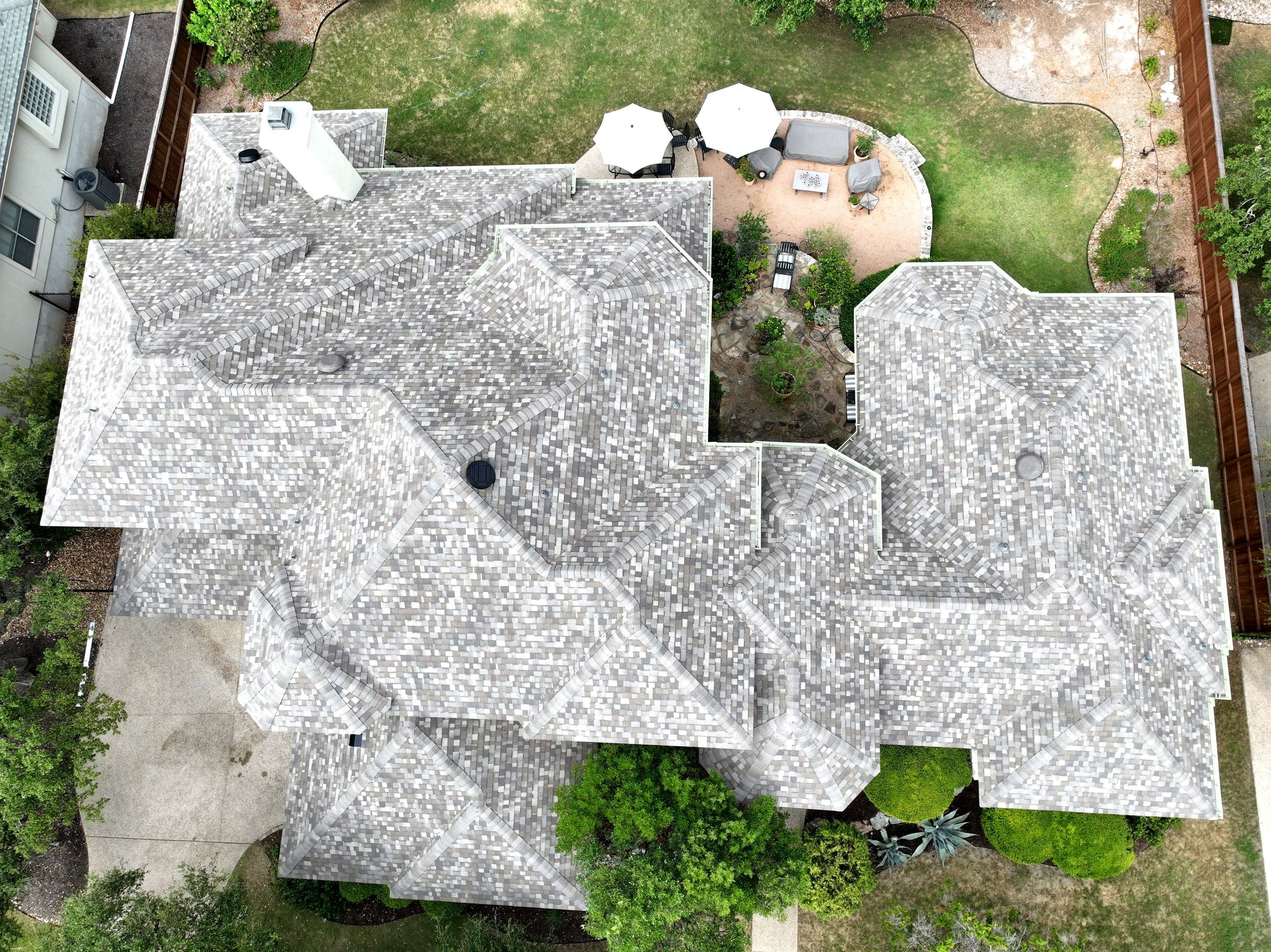 Residential Roof Replacement using 30 Year Laminate Shingles with High Profile Ridge by Premier Roofing and Contracting