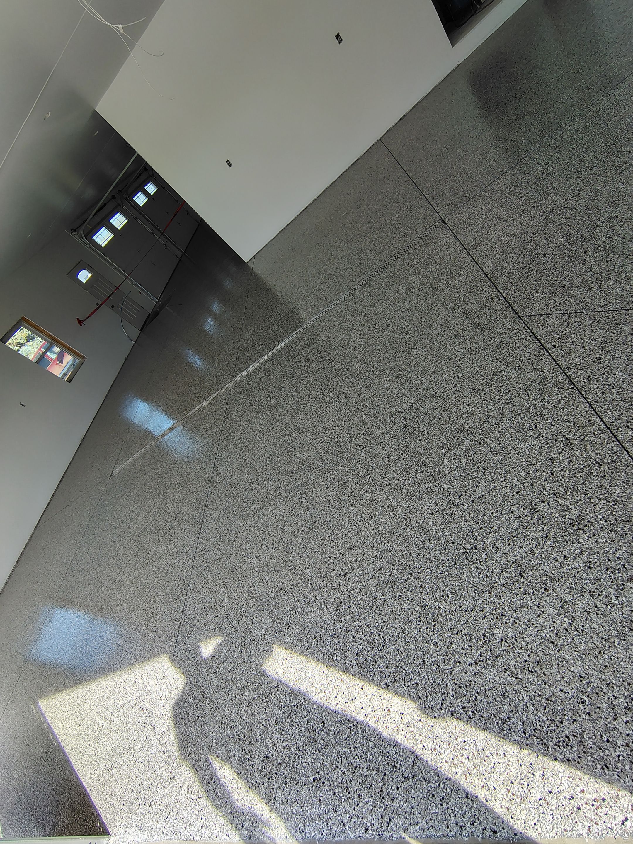Custom Garage and Basement Epoxy Floor Coating in Menno by Select Painting, Coatings & Garage Cabinets