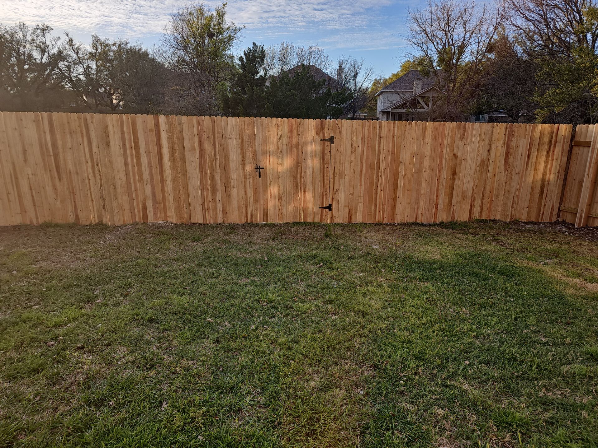 Fence Installation using Cedar Pickets by DeZign Roofing & Exteriors