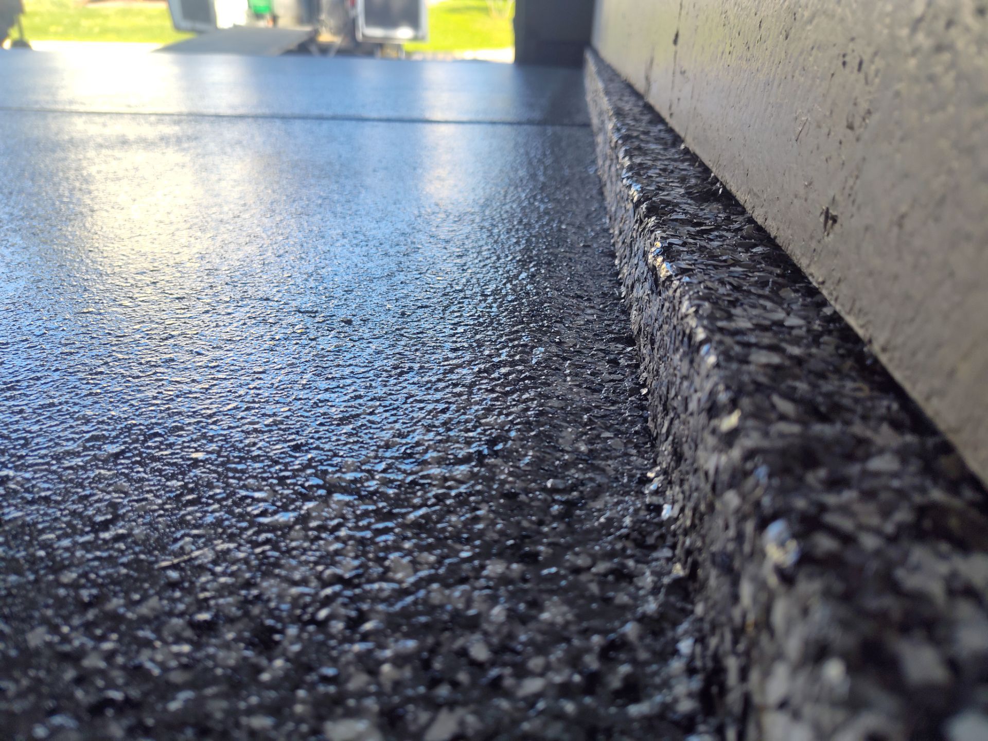 Close Up View of This Customer's New Flake Coating by Revival Concrete Coatings