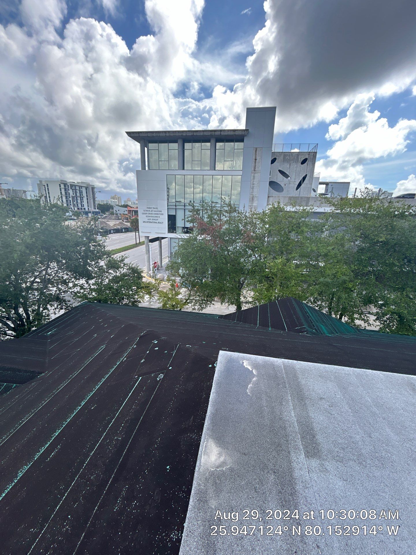 COMMERCIAL REROOF 24 GUAGE MEDIUM BRONZE 1-1/2" MECHANICAL SEAM "ZEBRA METHOD" by Earl W. Johnston Roofing 