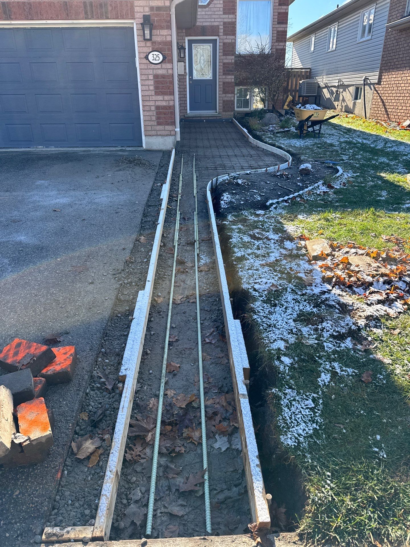 A finished concrete curb and walkway project by Tor Contracting Inc., demonstrating clean lines and high-quality craftsmanship.