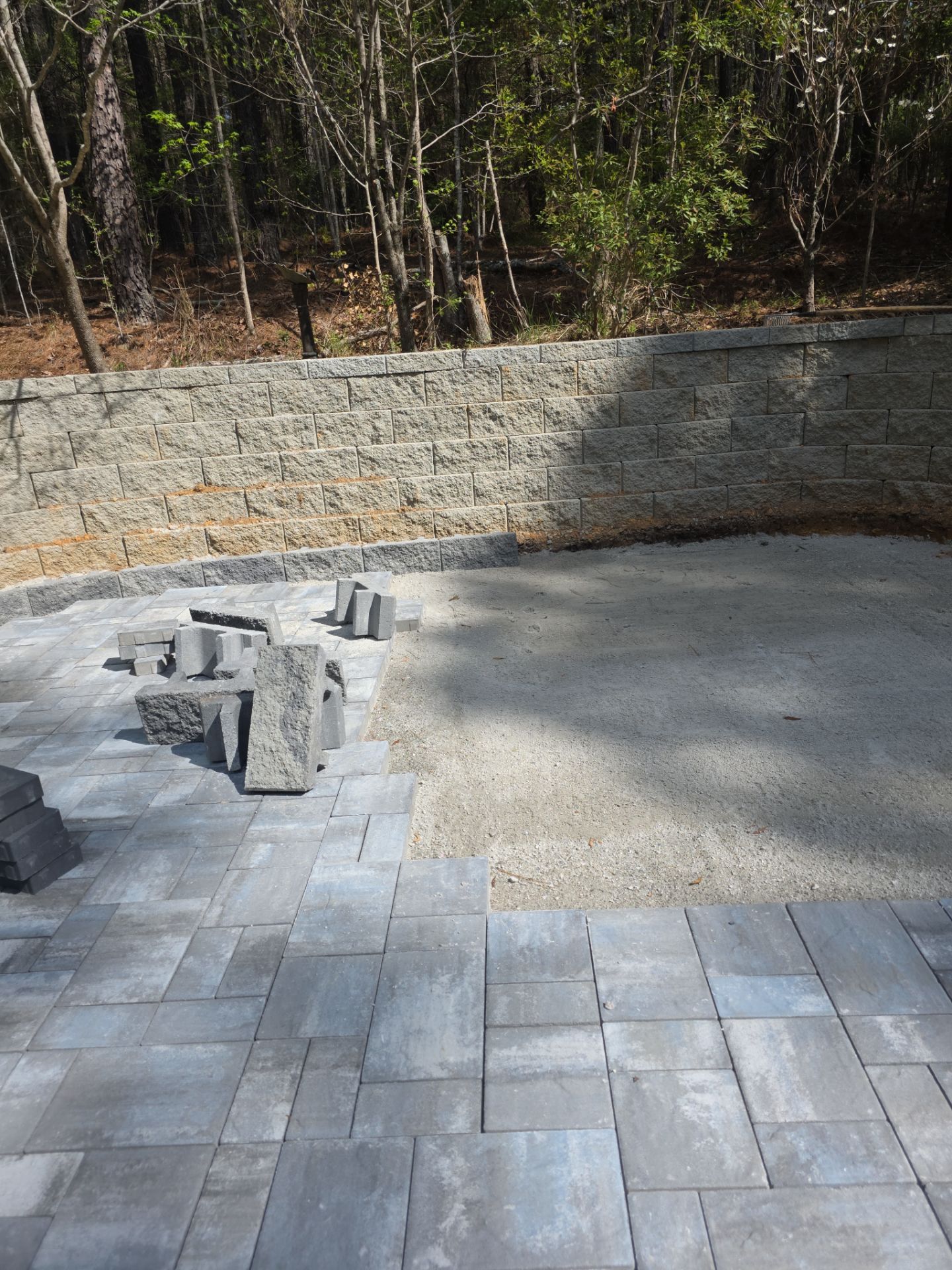 Pittsboro Outdoor Living Transformation – Retaining Wall, Paver Patio & Elevated Deck by Elite Remodeling and Design LLC