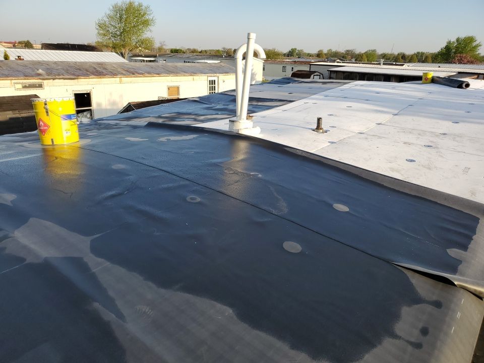Residential Roofing Installation using 60 mil rubber roof  by Nitro Roofing and Construction