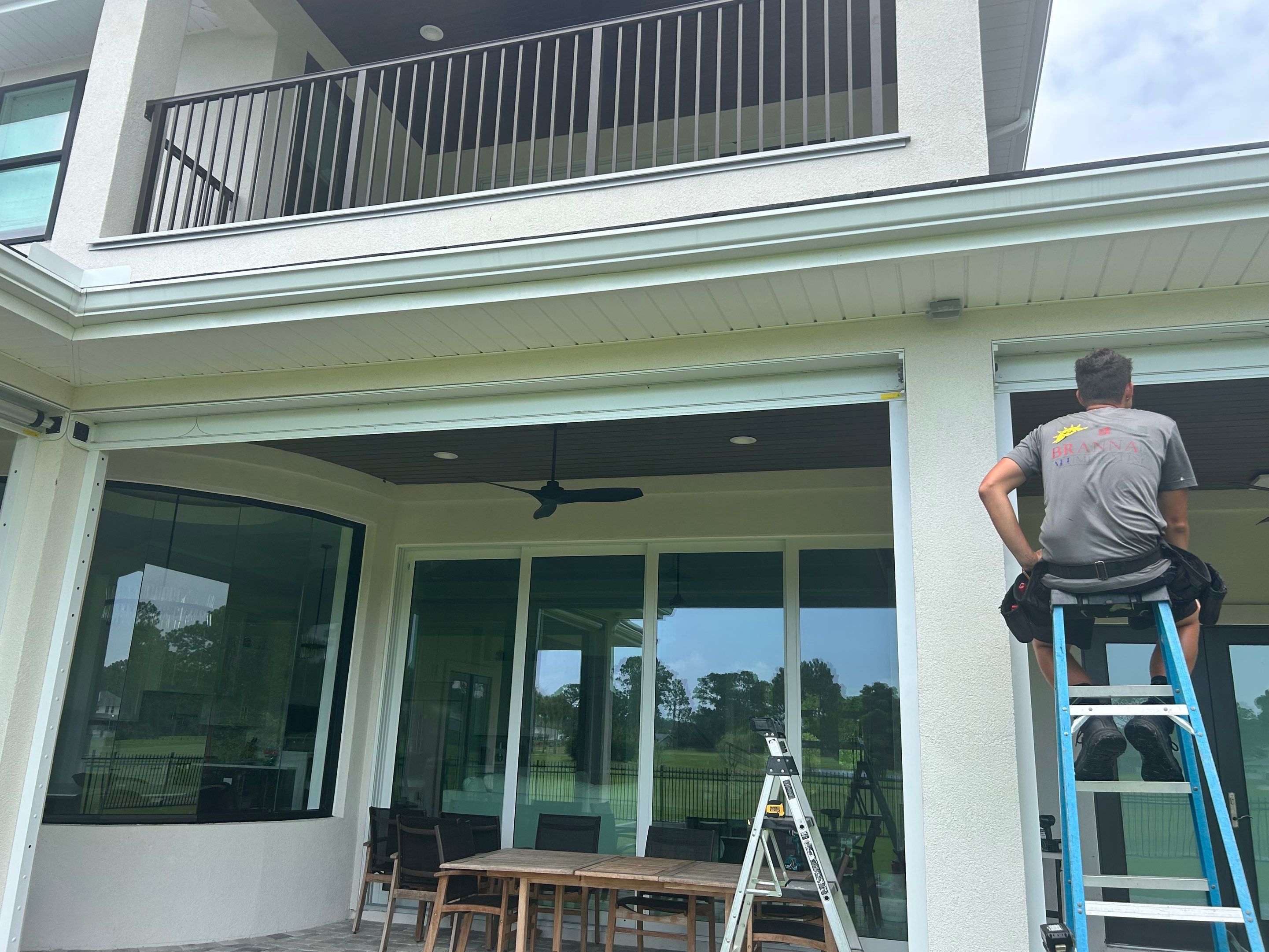 Motorized Screen and Solar Shade Installation in Panama City Beach by Brannan Aluminum Inc.