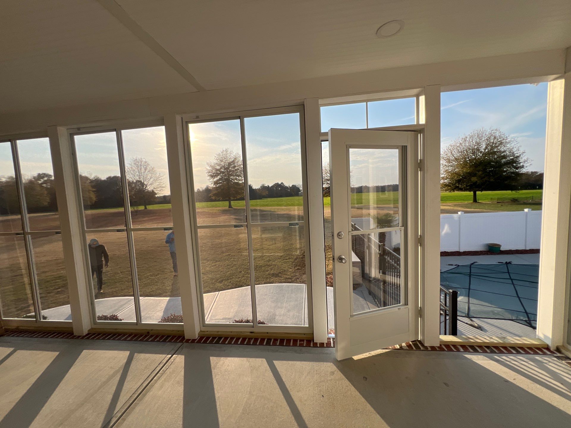 Custom Screened Porch and Concrete Walkway Installation in Rocky Mount by The Remodeling Company