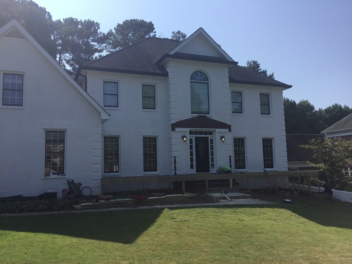 Custom Front Porch Construction with White Railing in Dunwoody by Swift Home Renovations