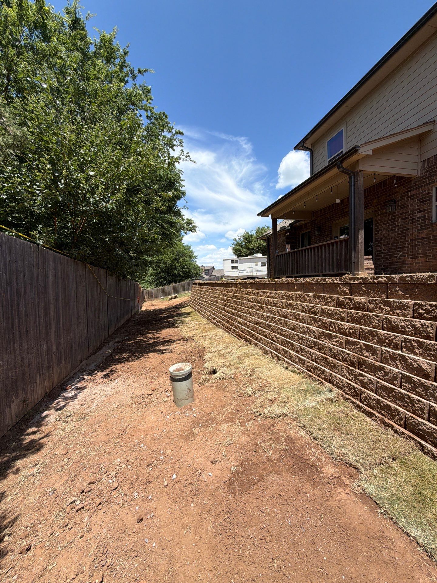 Custom Segmental Block Retaining Wall and Sod Installation in Lawton by Clays Services Inc