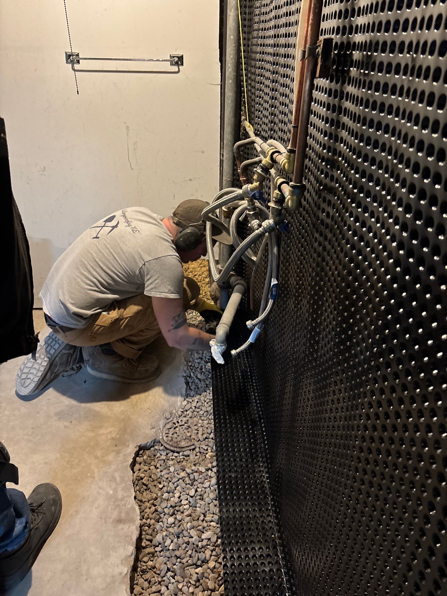 Interior Drain Tile & Buried Discharge in South Minneapolis by Waterproofing Northeast