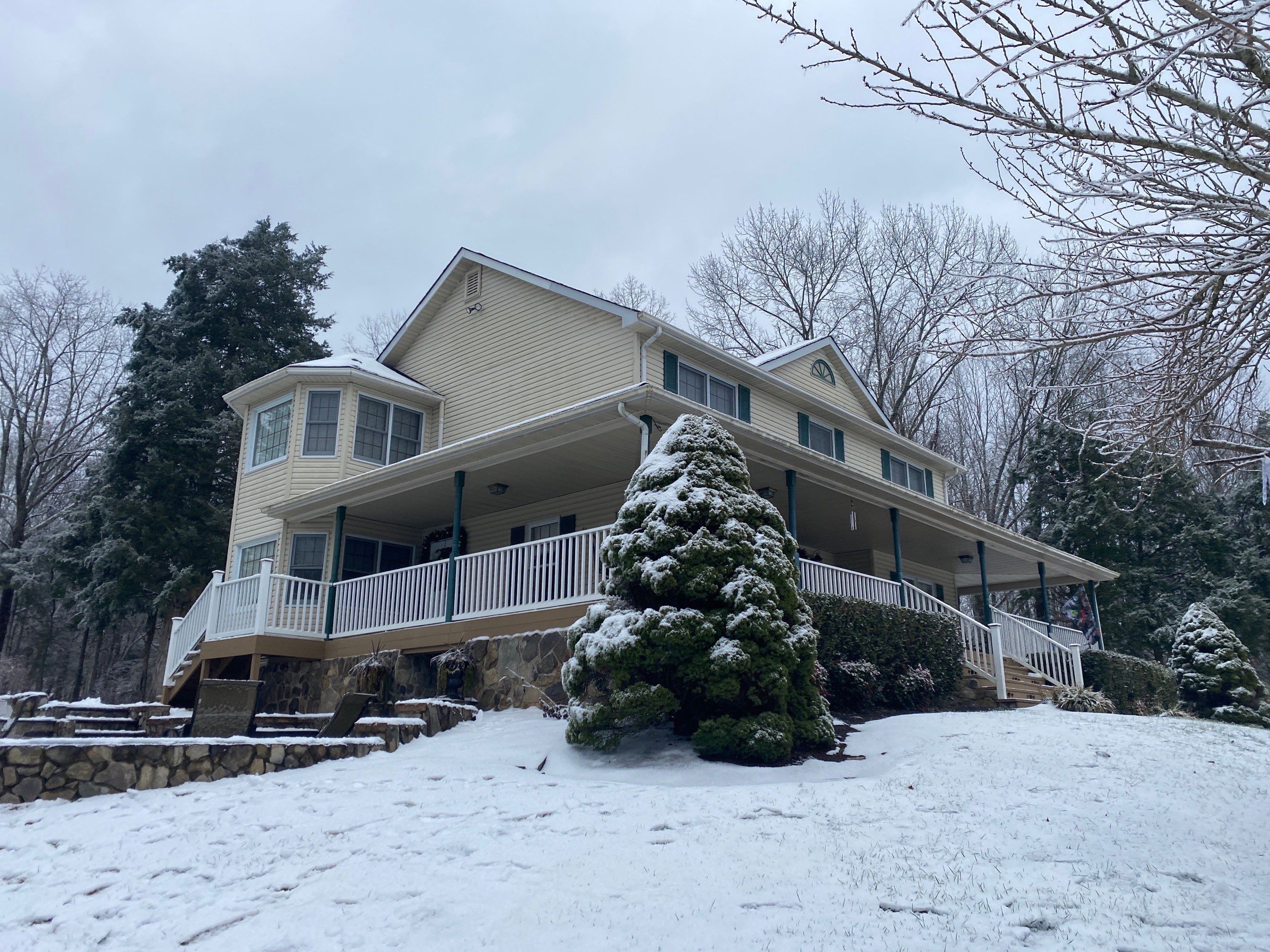 Exterior remodel including window replacement by American Home Contractors