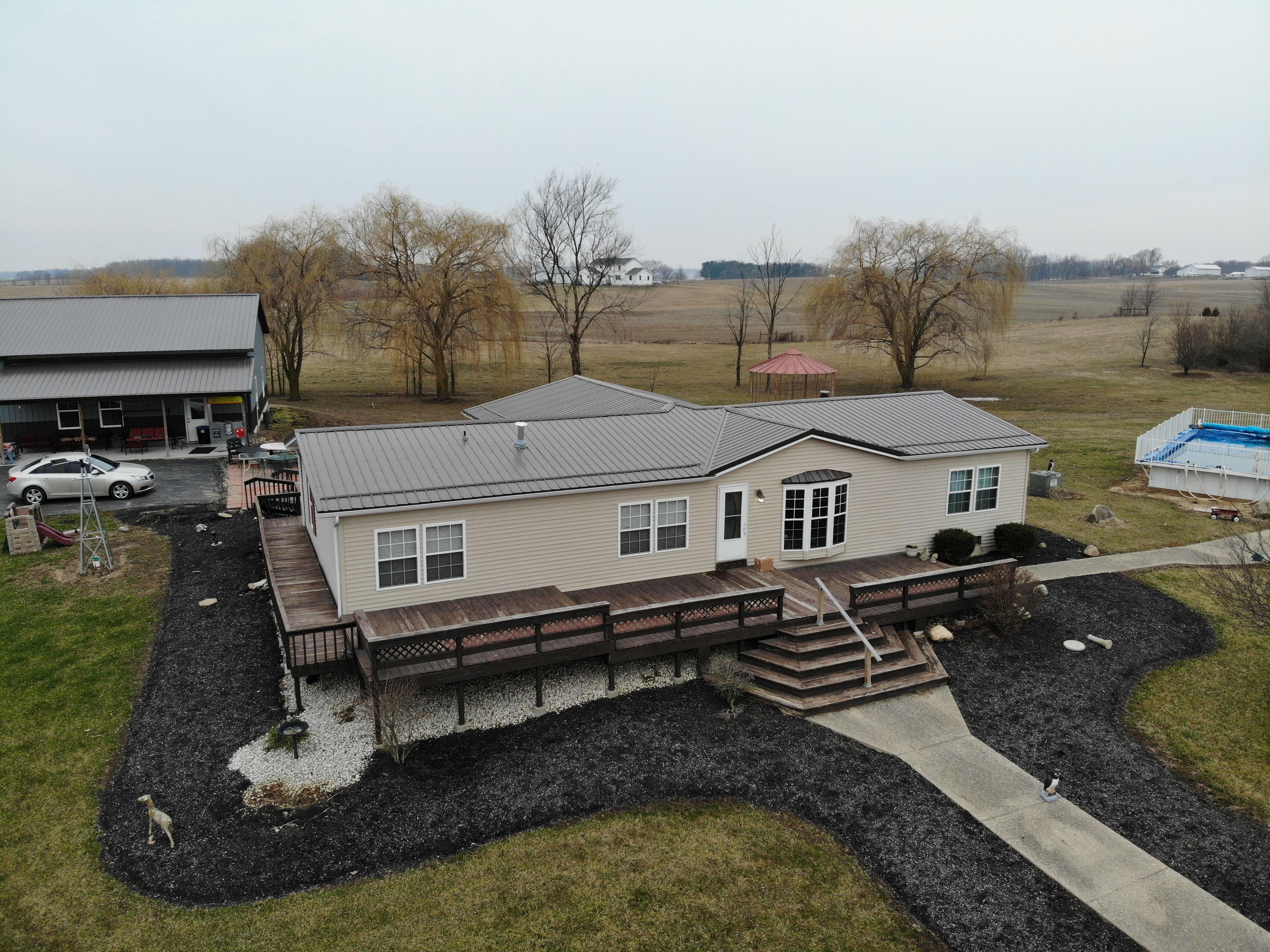 Exposed Fastener Metal Roof on Multi-Home Property in Columbia City, Indiana by 4Ever Metal Roofing