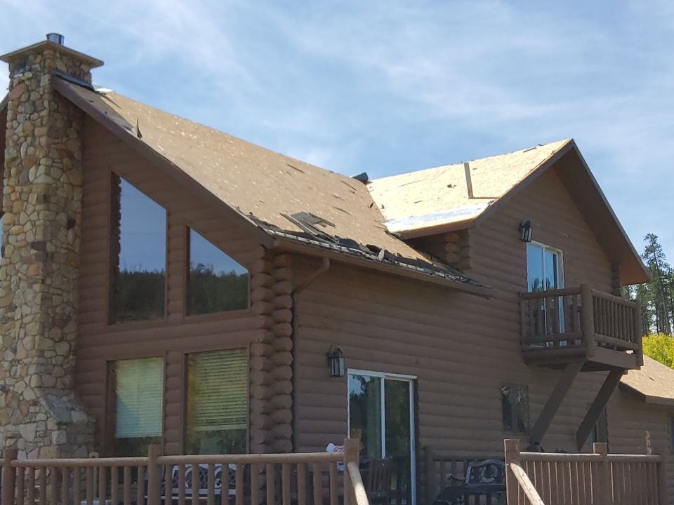 Hill Country Guest Ranch using Steel Roofing, Gutters, Log Cabin Staining by Lightning Exteriors