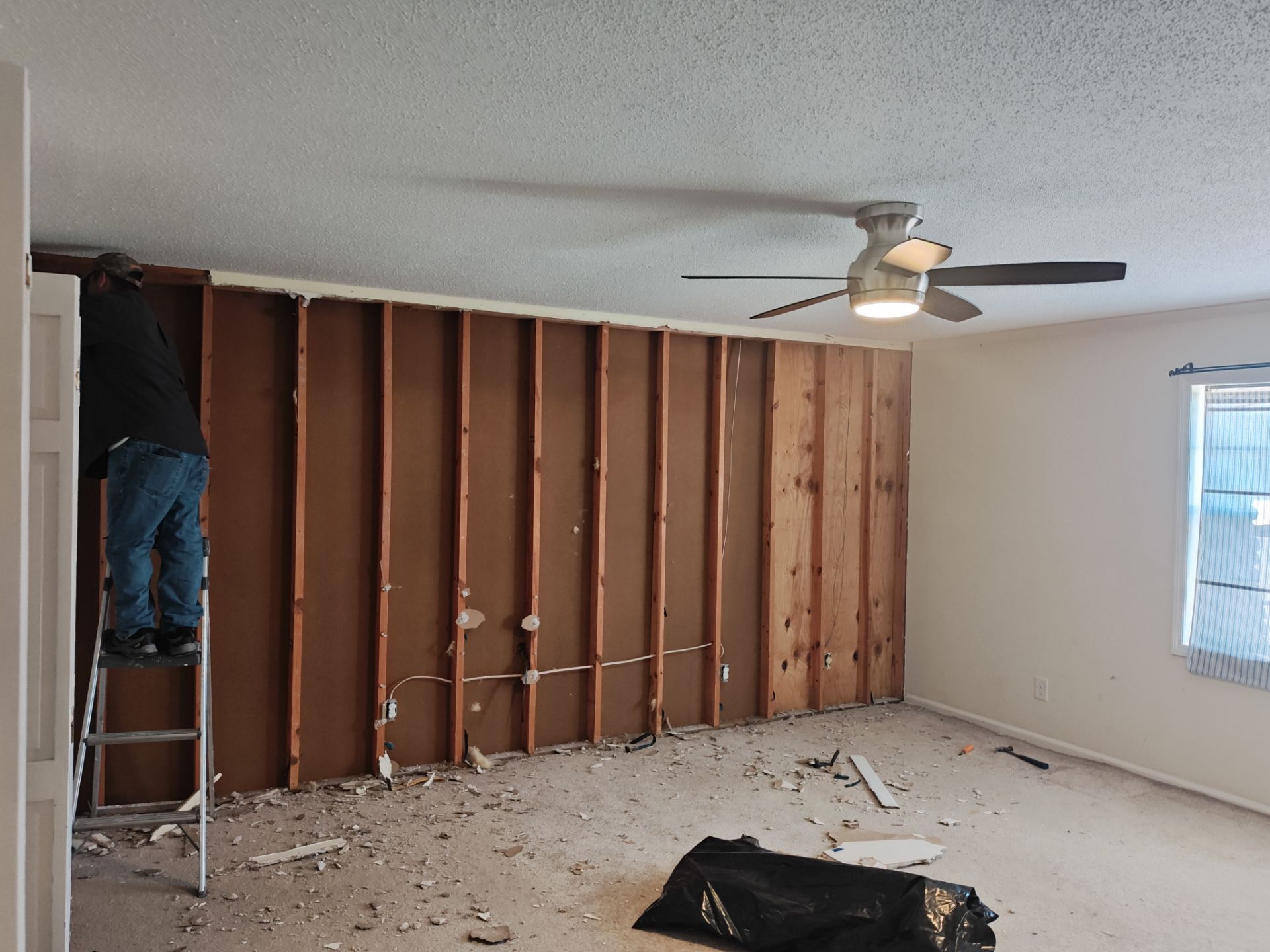 Interior Renovation Featuring Stone Fireplace and Subfloor Restoration in Valdosta by Trinity General Contracting Pros
