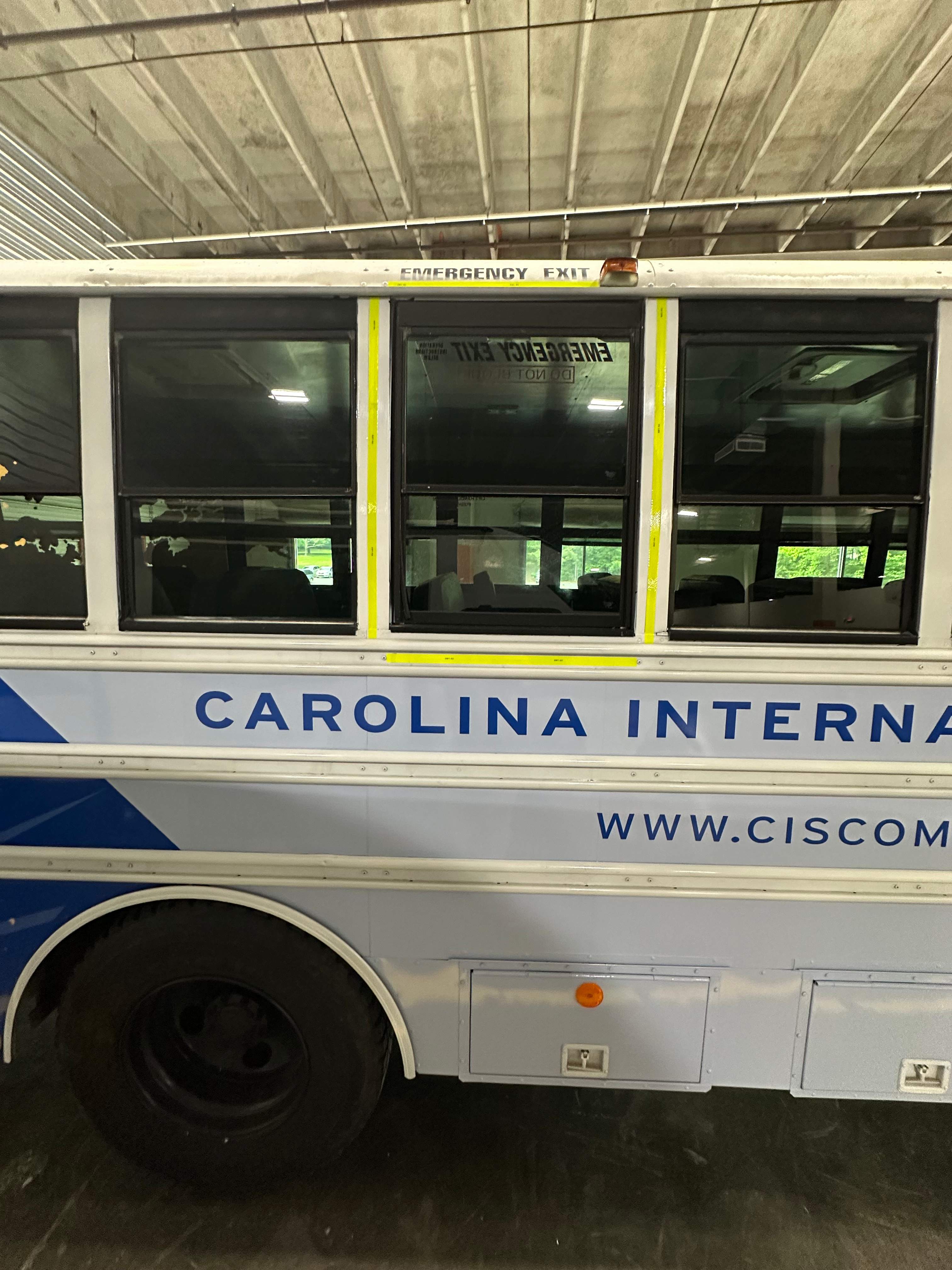 Carolina International School - Bus Vinyl Wrap by QC Signs and Graphics