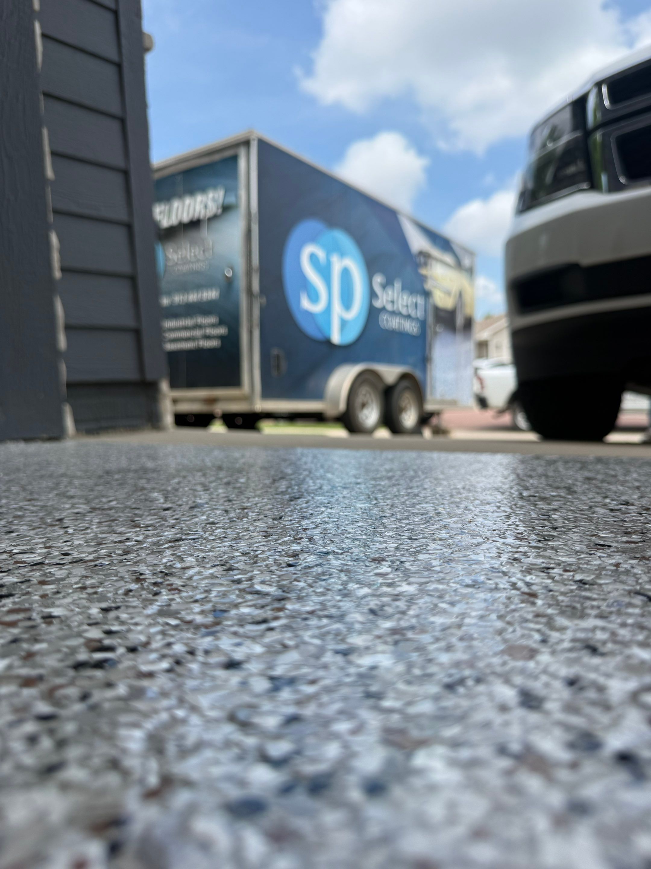 Full Garage Floor Resurfacing and Decorative Epoxy Flake Finish by Select Painting, Coatings & Garage Cabinets