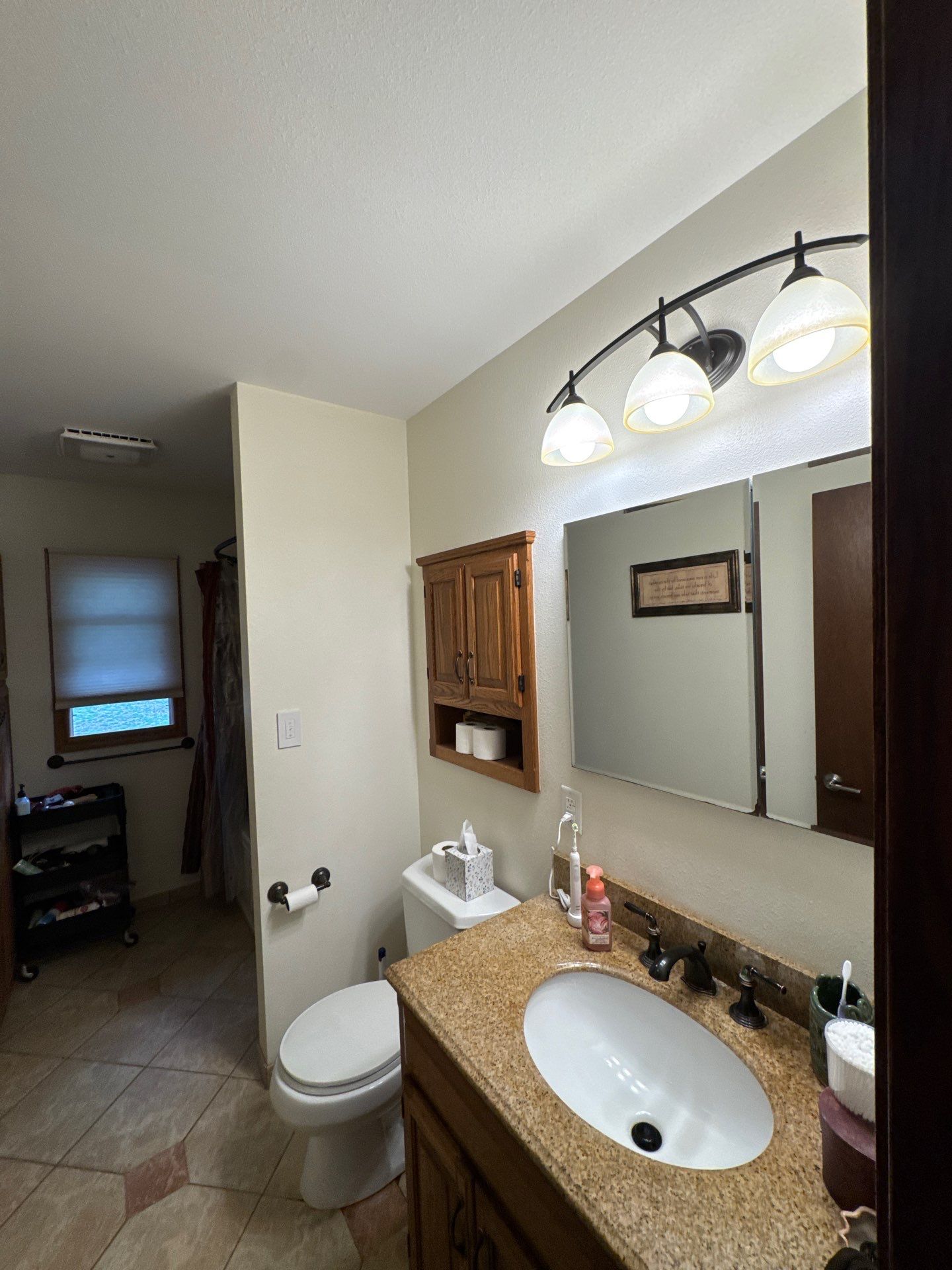 Bathroom Remodel Featuring Stone Tile and Granite Vanity in Mukwonago by OCS Contracting Services